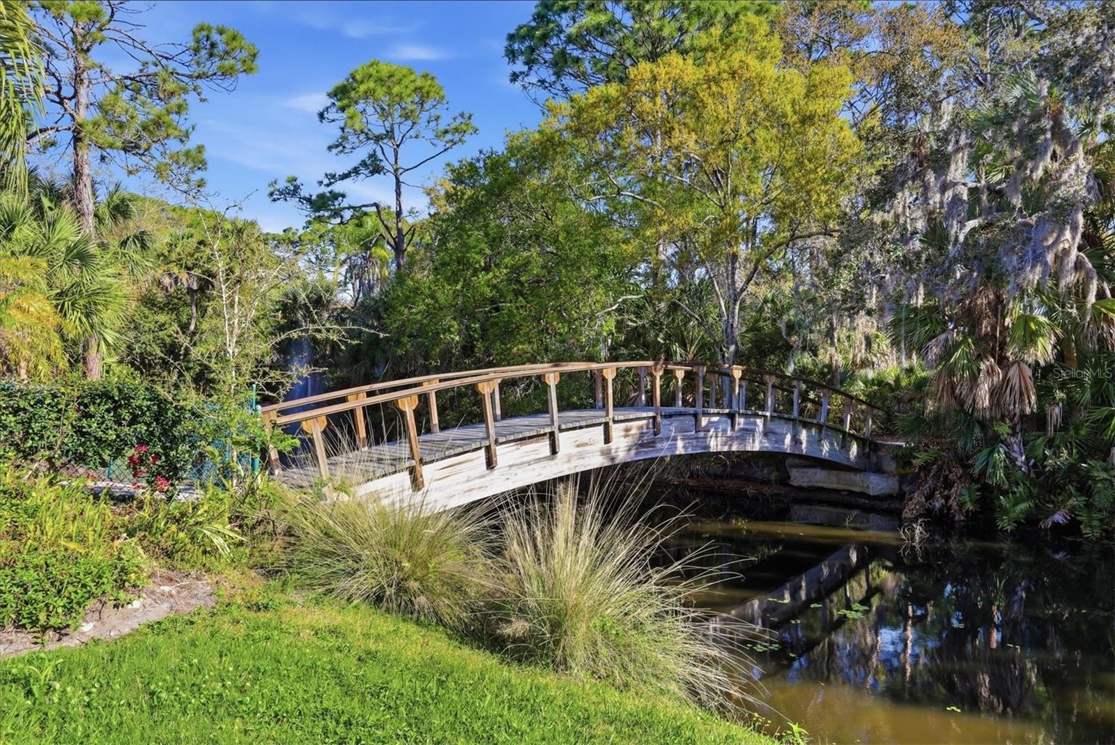 Private footbridge steps from your door!