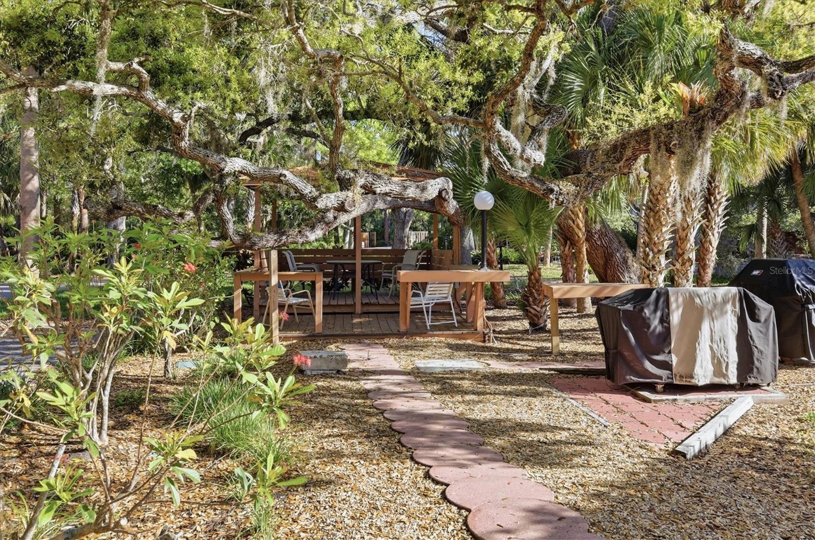 Picturesque Gazebo with seating and gas grills