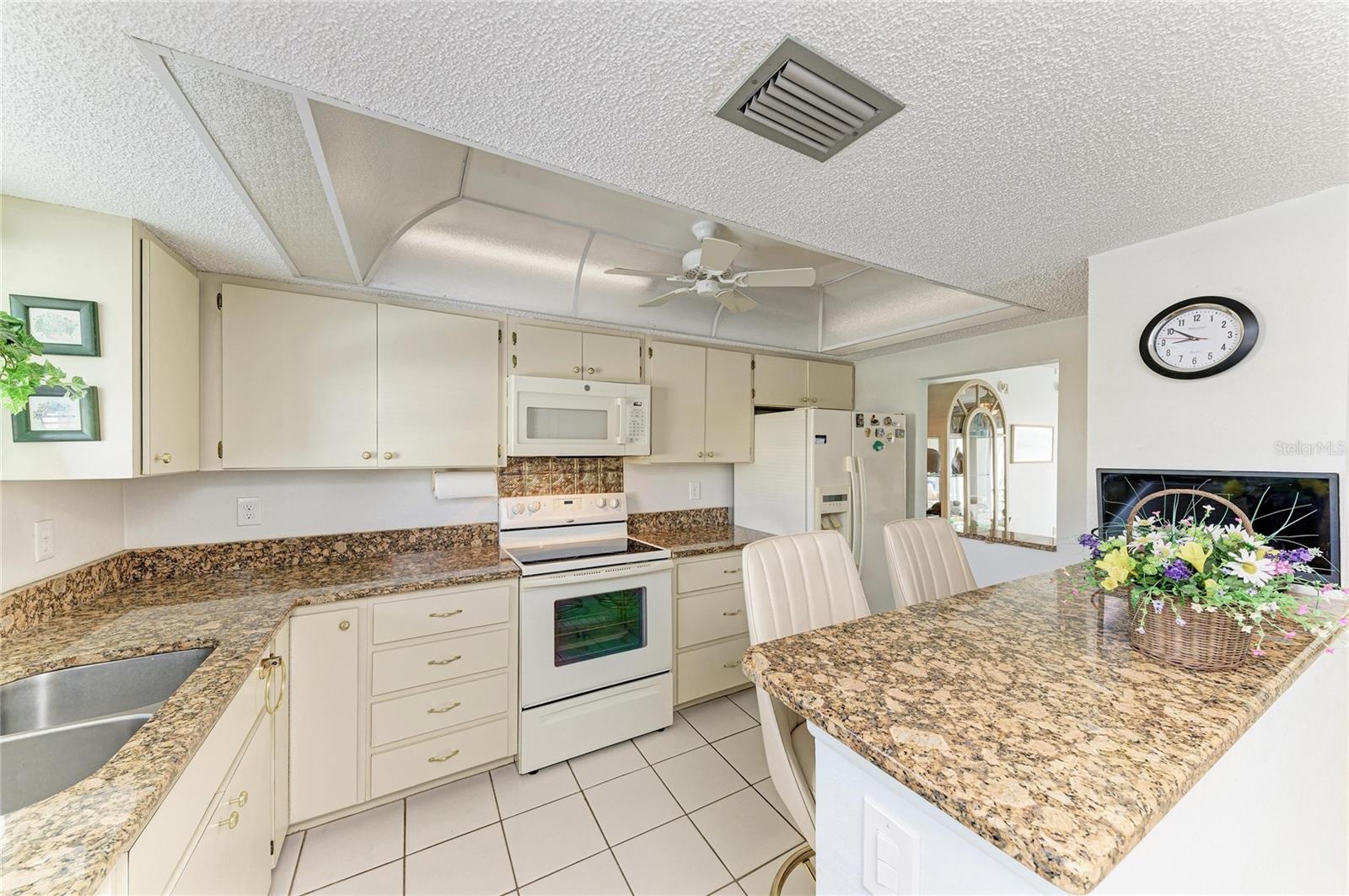 Kitchen with plenty of cabinets and a pantry.
