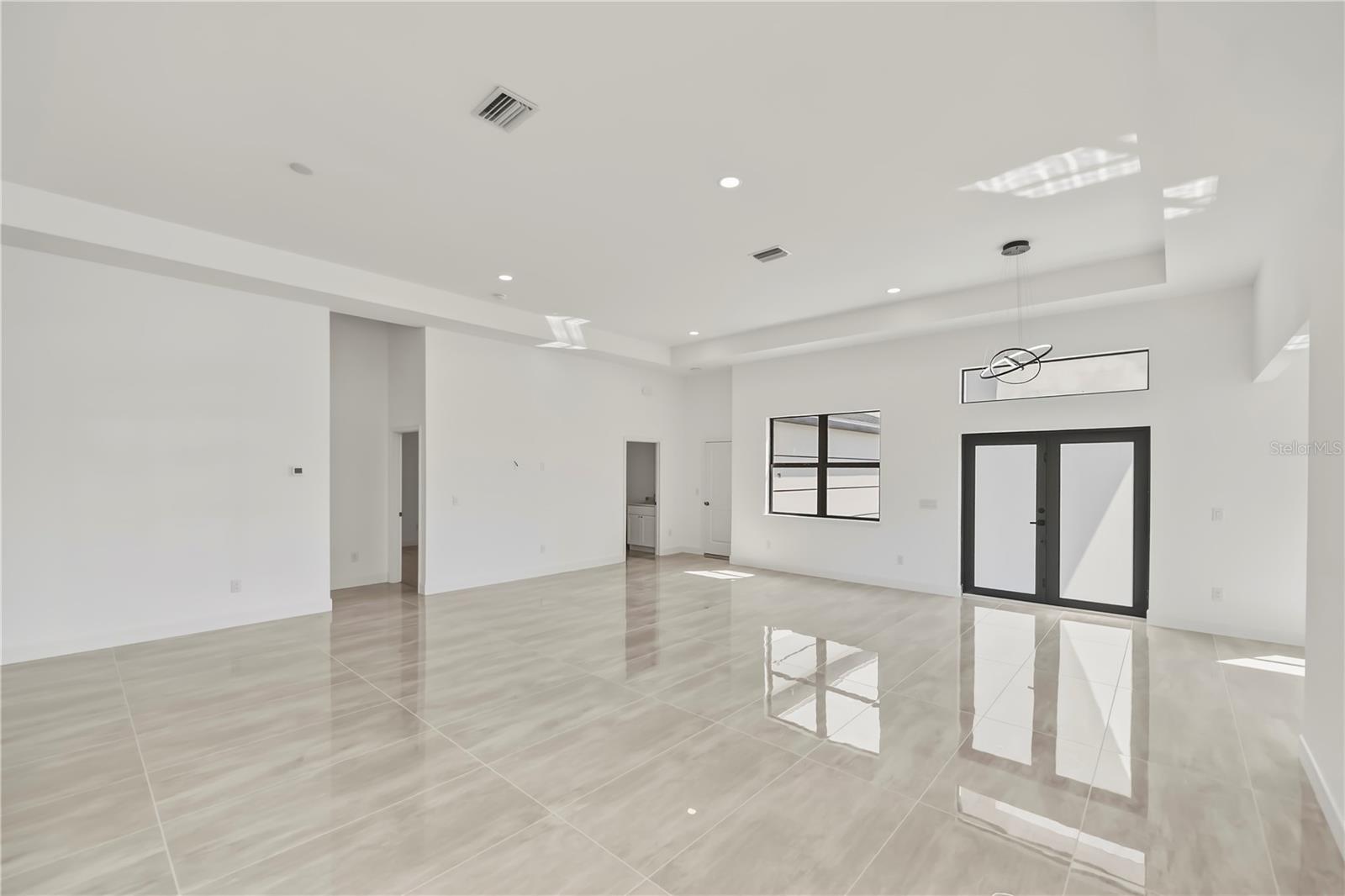 Expansive Living Room with Elegant Tray Ceiling.