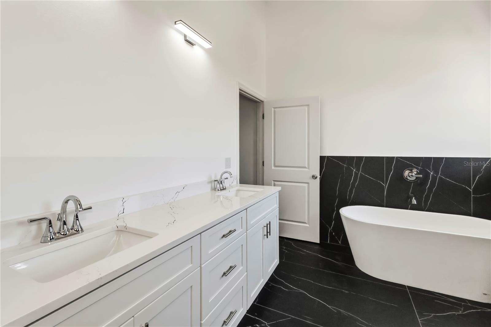 Spa Inspired Primary Bath with Dual Vanities.