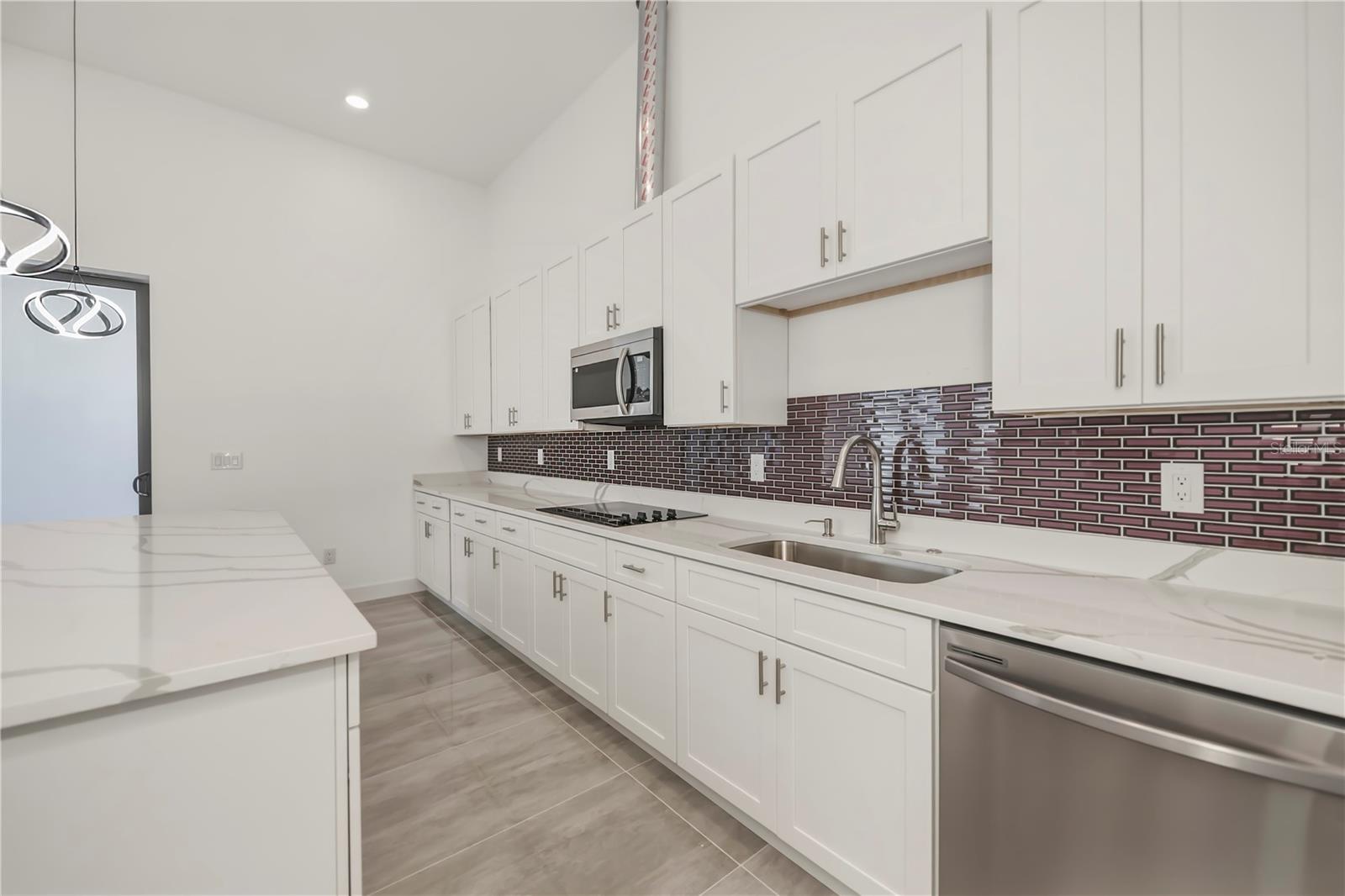 Chef's Kitchen with Quartz Counters and Custom Cabinetry.