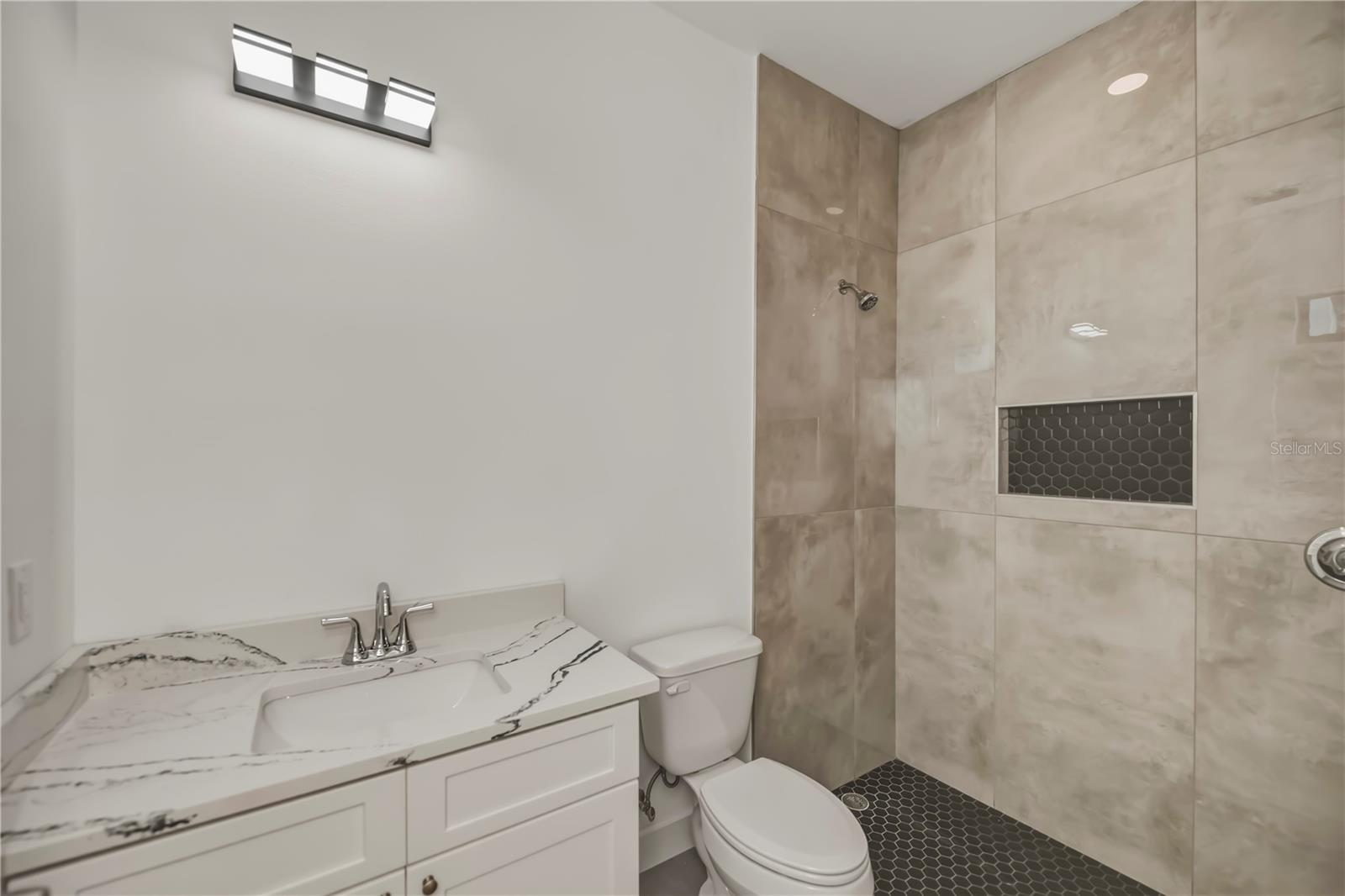 Second Bathroom with Tiled Walk-In Shower.