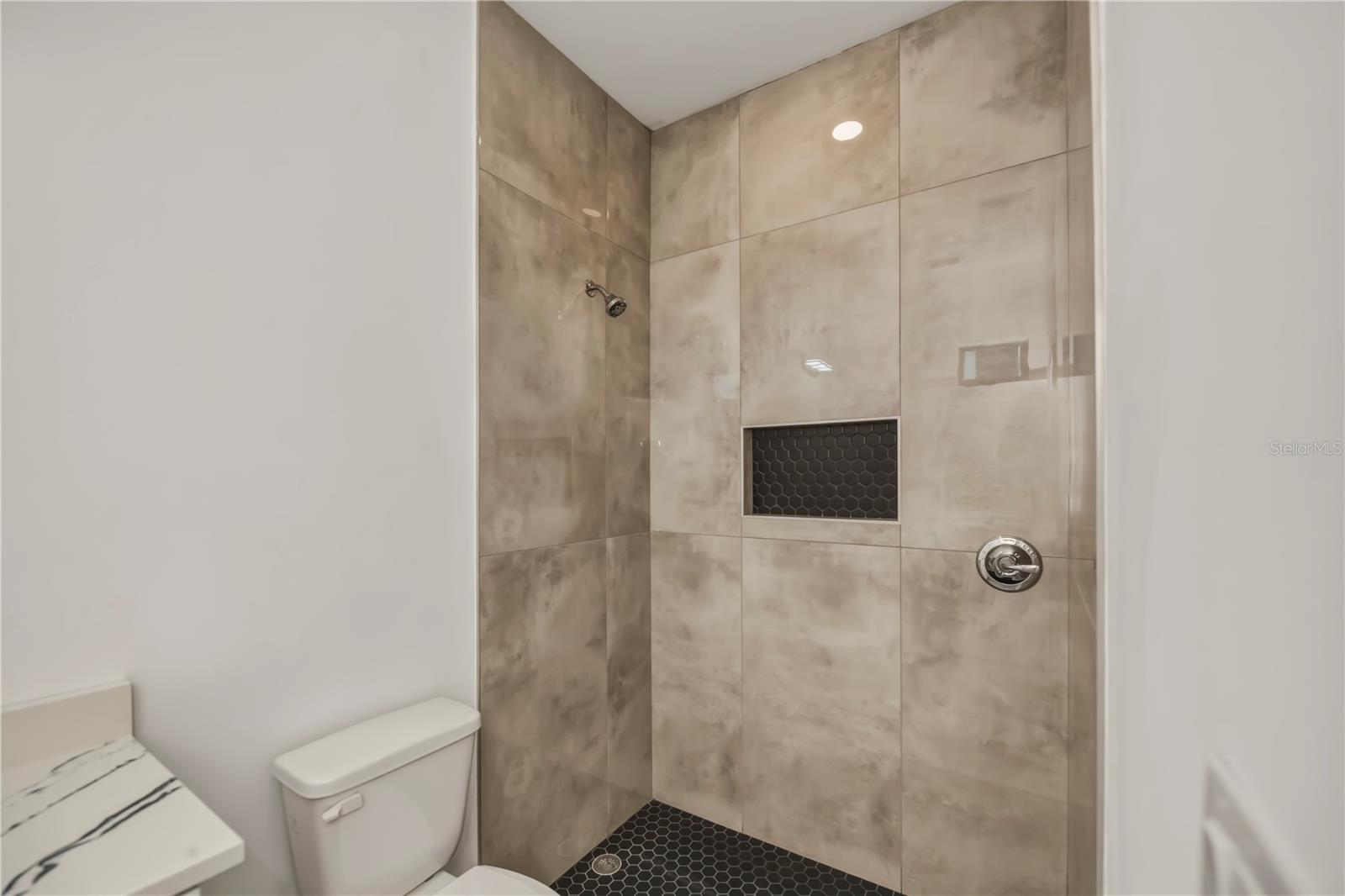 Second Bathroom with Tiled Walk-In Shower.