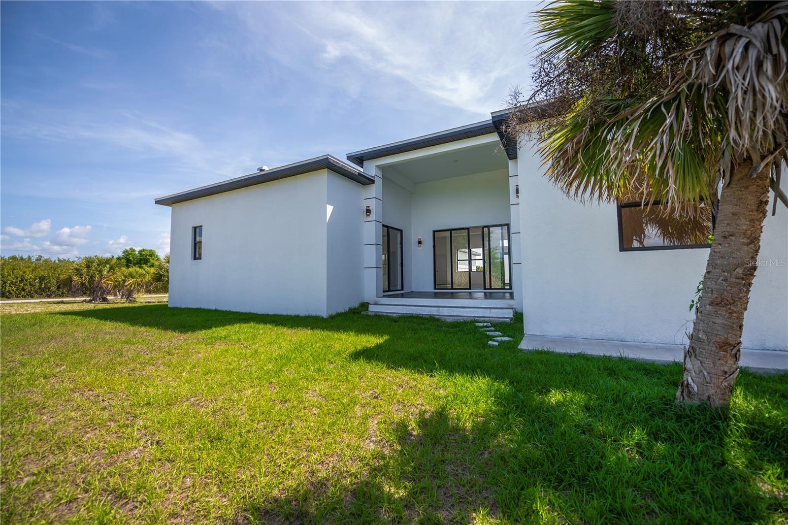 Easy Access from Patio to Backyard.