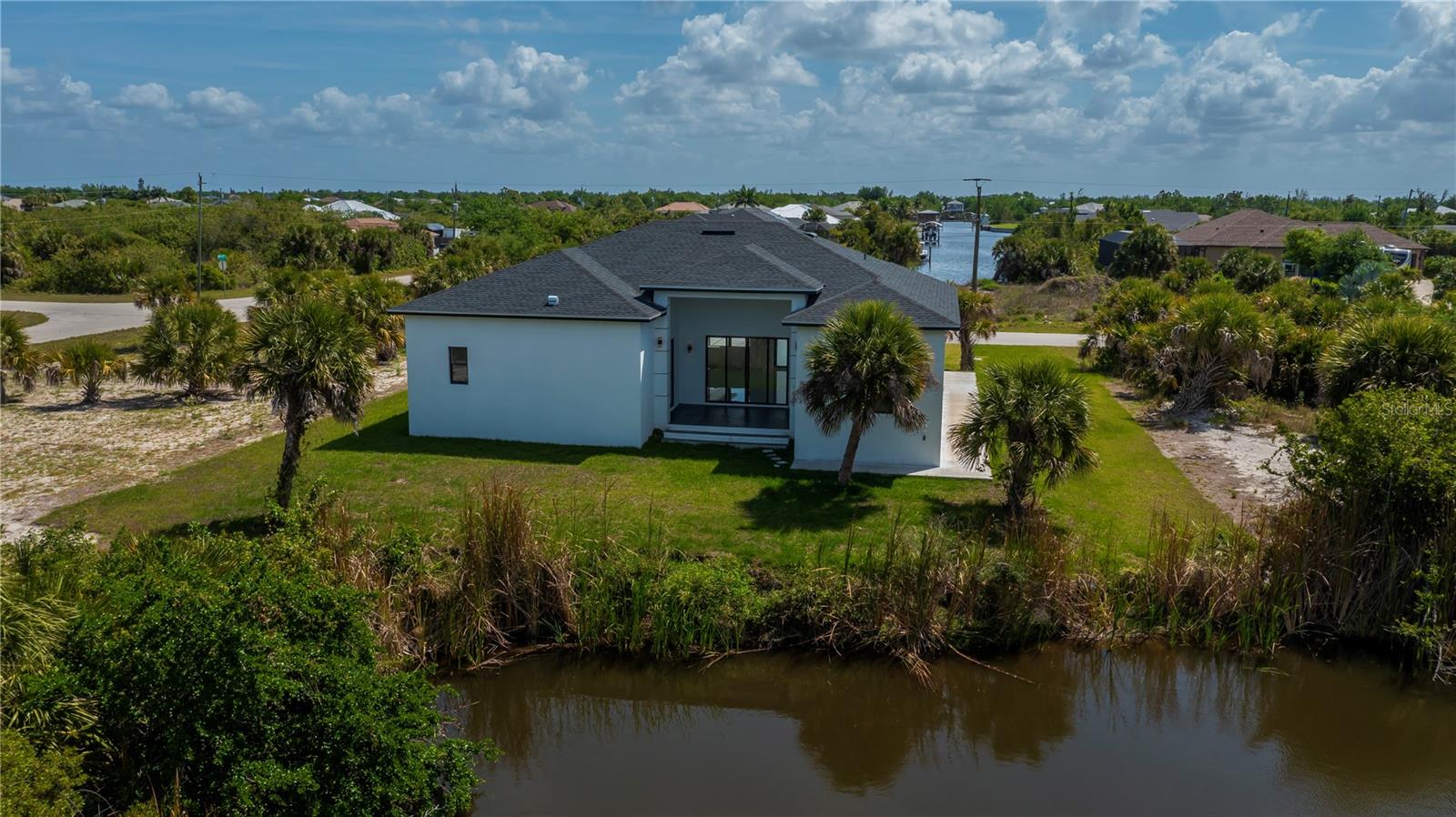 Nearly Half-Acre Double Corner Lot with Gulf Access.