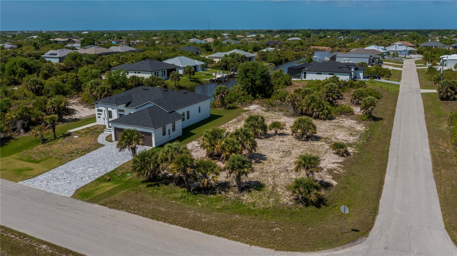 Nearly Half-Acre Double Corner Lot with Gulf Access.