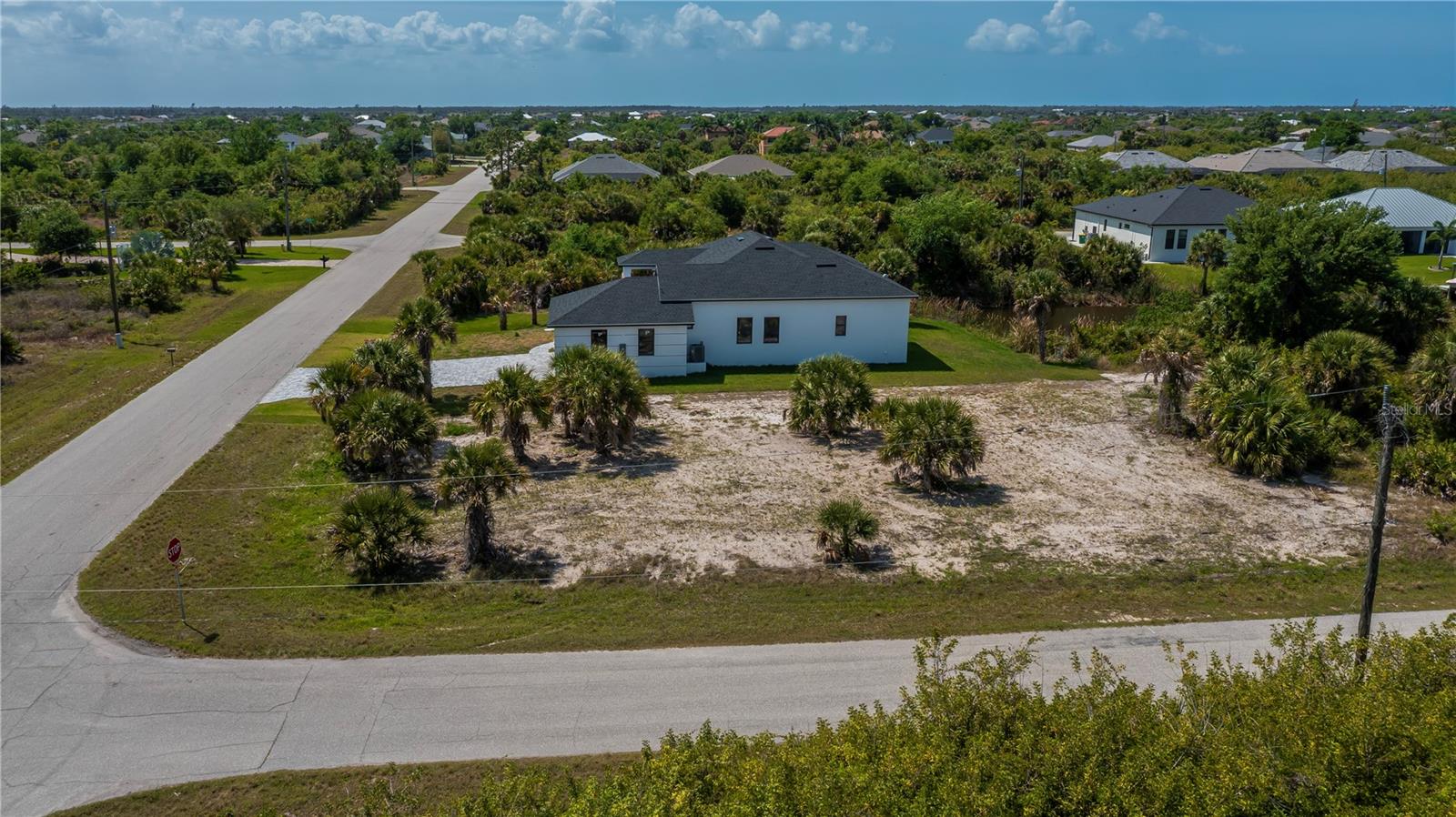 Nearly Half-Acre Double Corner Lot with Gulf Access.