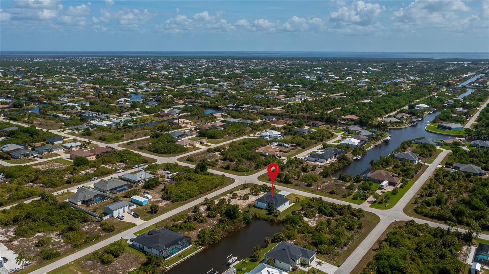 Nearly Half-Acre Double Corner Lot with Gulf Access.