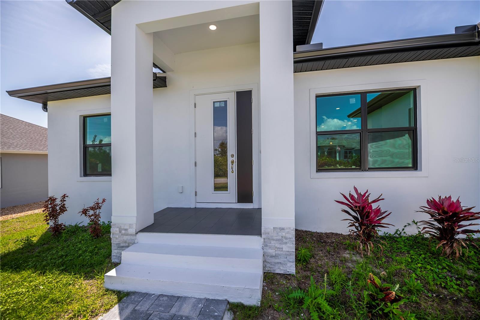 Inviting Front Porch with Elegant Contemporary Appeal.