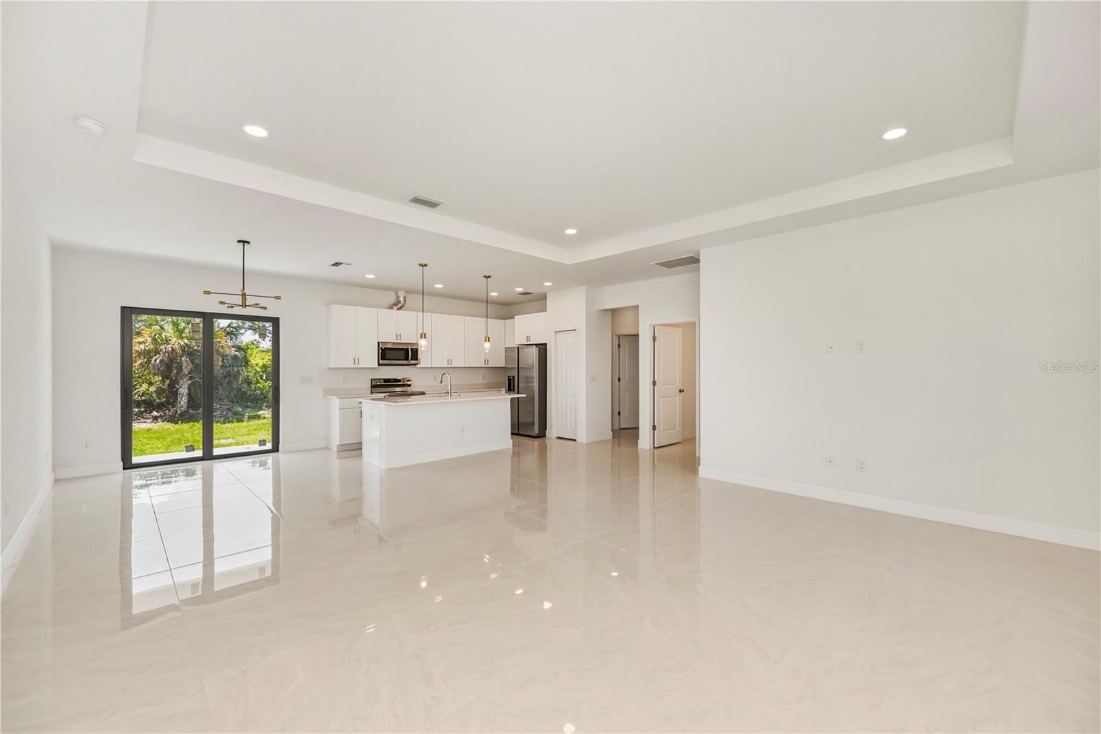 Open Concept Living Room with Soaring Tray Ceilings.