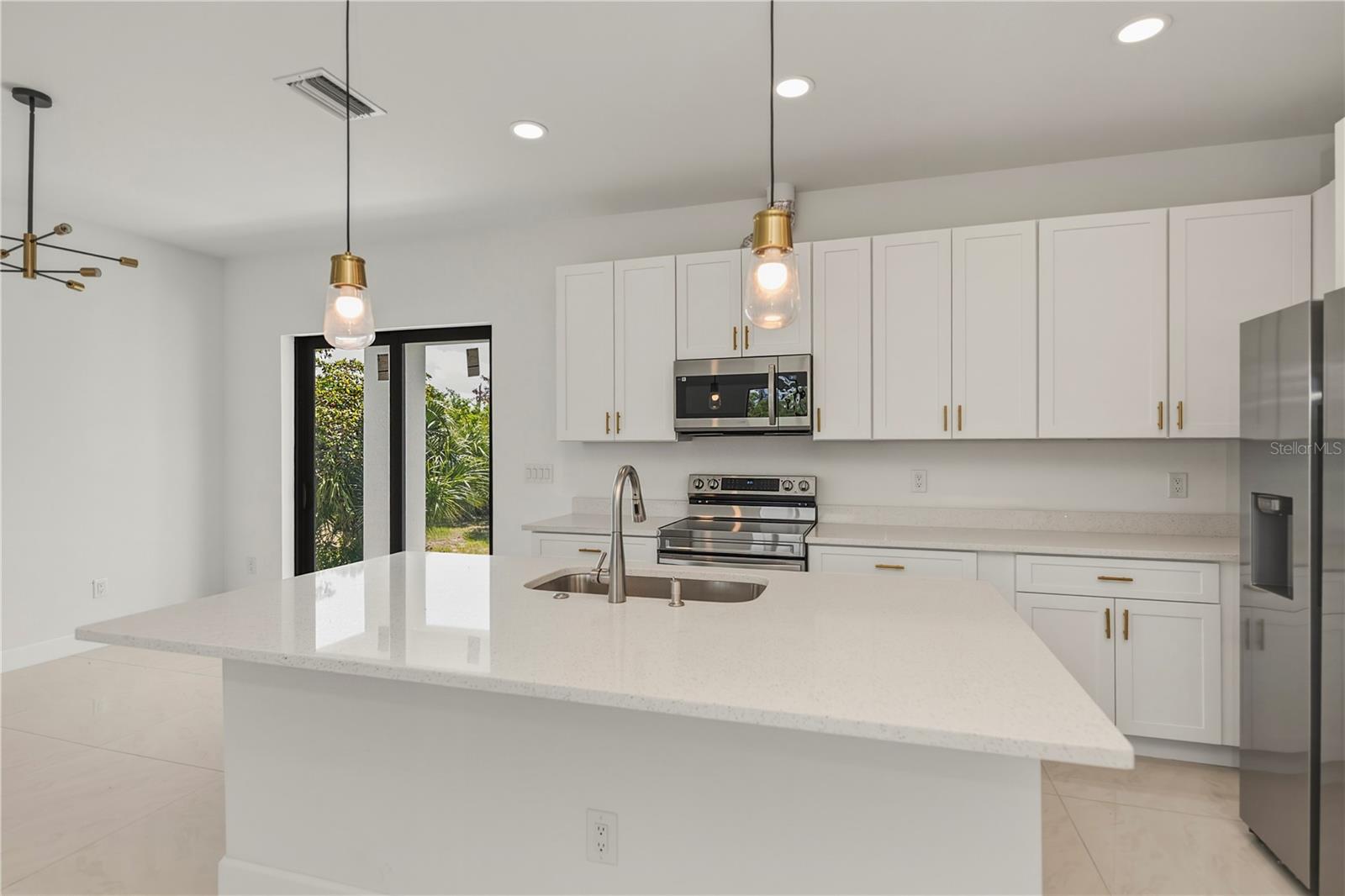 Chef's Kitchen with Quartz Counters and Expansive Island.