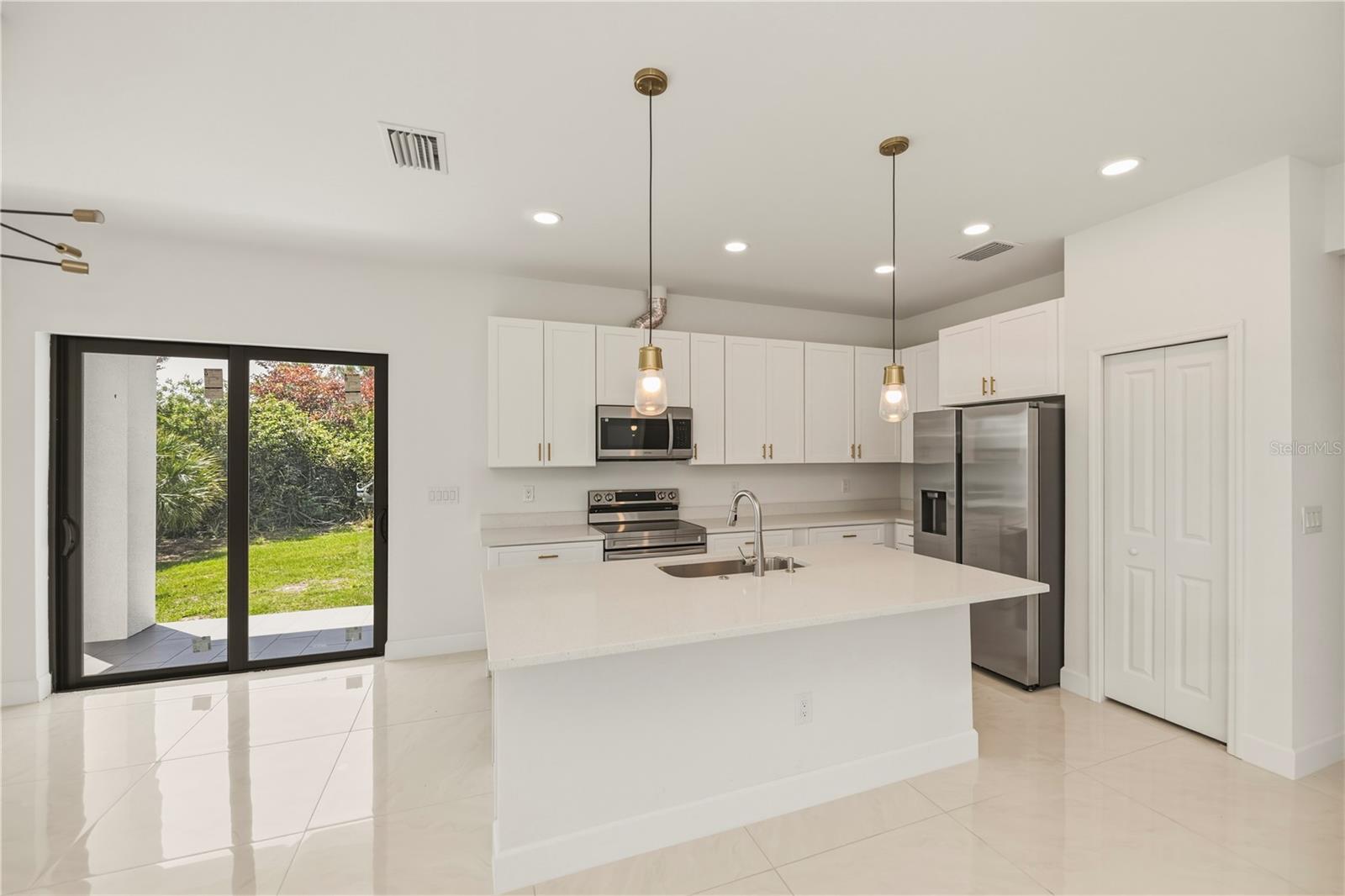 Spacious Quartz Island Anchors This Beautiful Open Concept Kitchen.