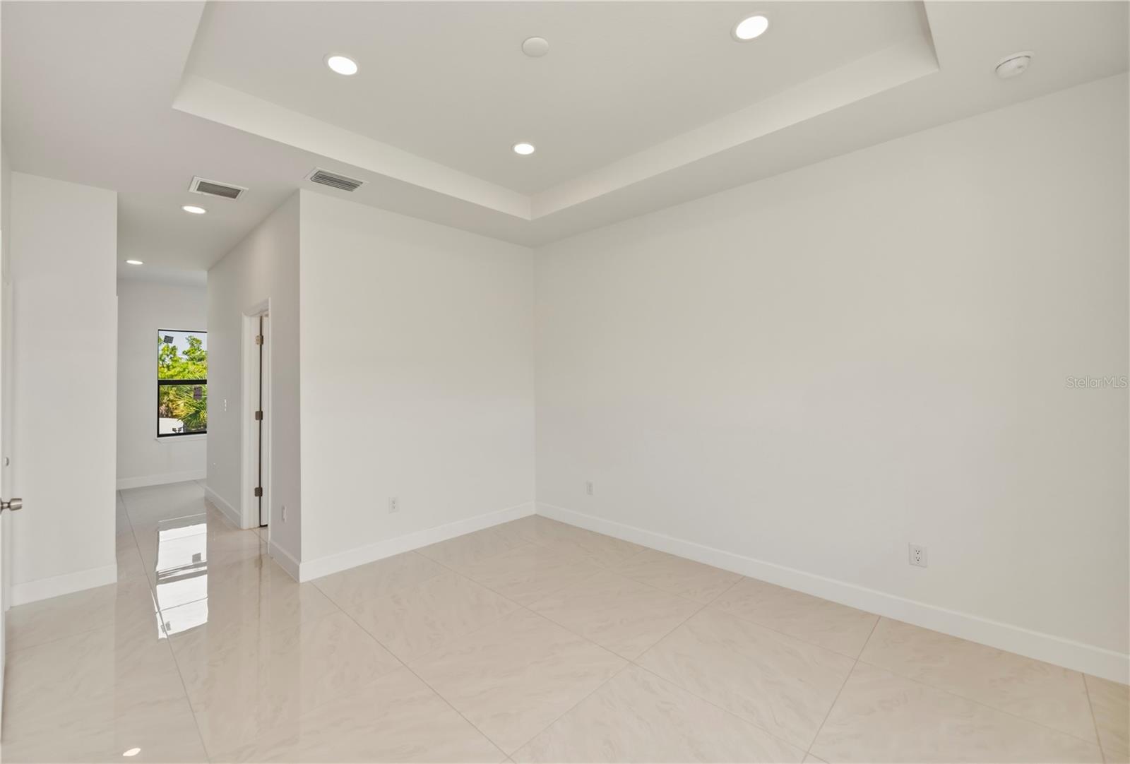 Primary Bedroom with Elegant Tray Ceiling.