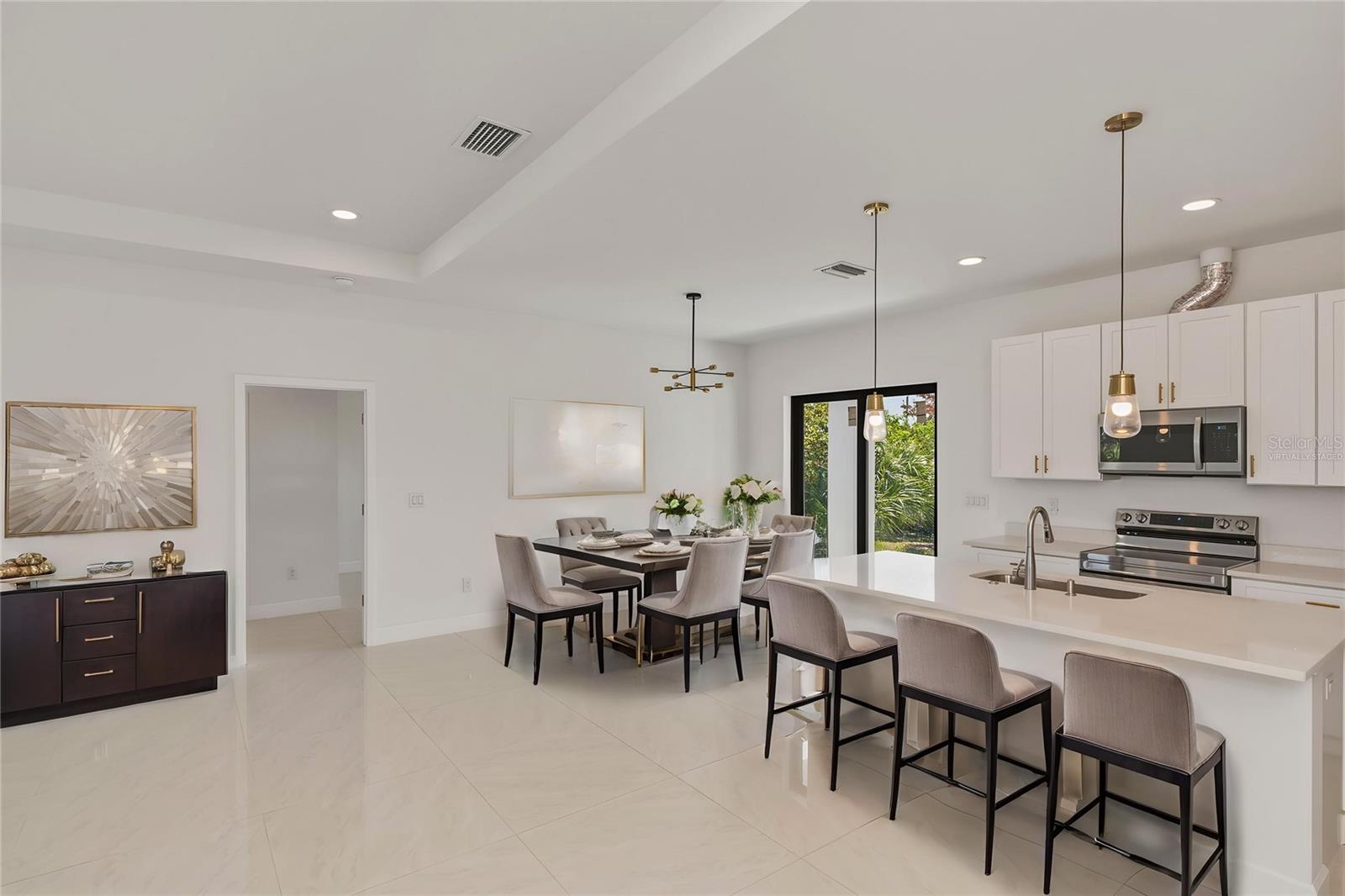 Virtually Staged Open Concept Kitchen and Dining Area.