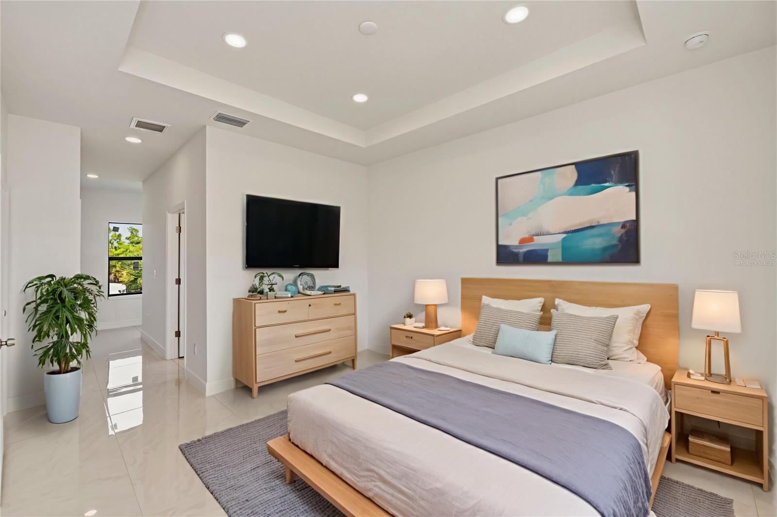 Virtually Stage Primary Bedroom with Spacious Layout and Tray Ceilings.