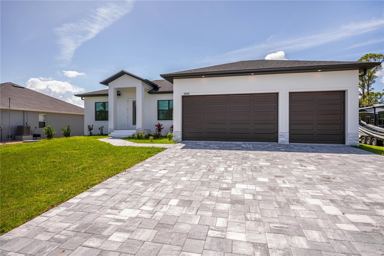 Modern 2025 Custom Home with Paver Driveway.