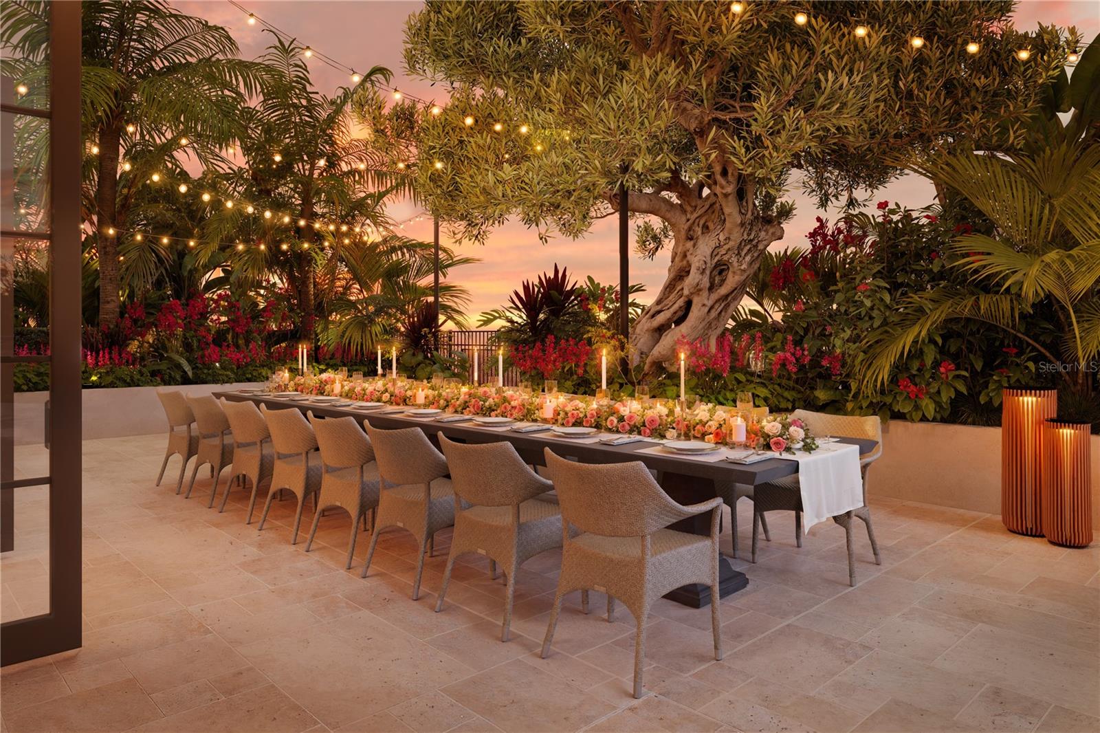 A beautifully landscaped garden terrace offers an intimate dining setting, where lush greenery and thoughtful design create a private oasis for residents to relax and entertain in style.