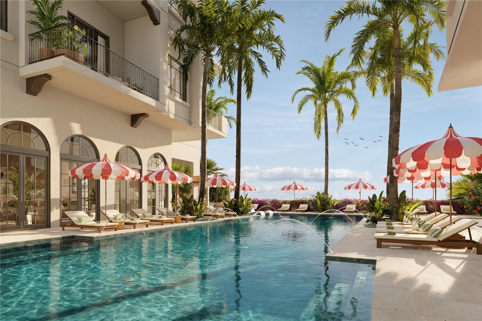 The 70-foot resort-style pool at Mira Mar is complemented by a lounging area with a spacious sun deck, hot tub, and dedicated towel service, creating a luxurious setting for relaxation and leisure.