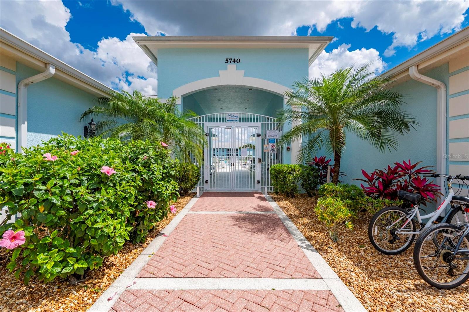 Entry to club house, pool, library and gym.