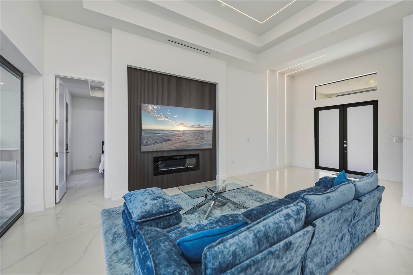 Media Wall with Floating Fireplace and LED Accent Lighting.