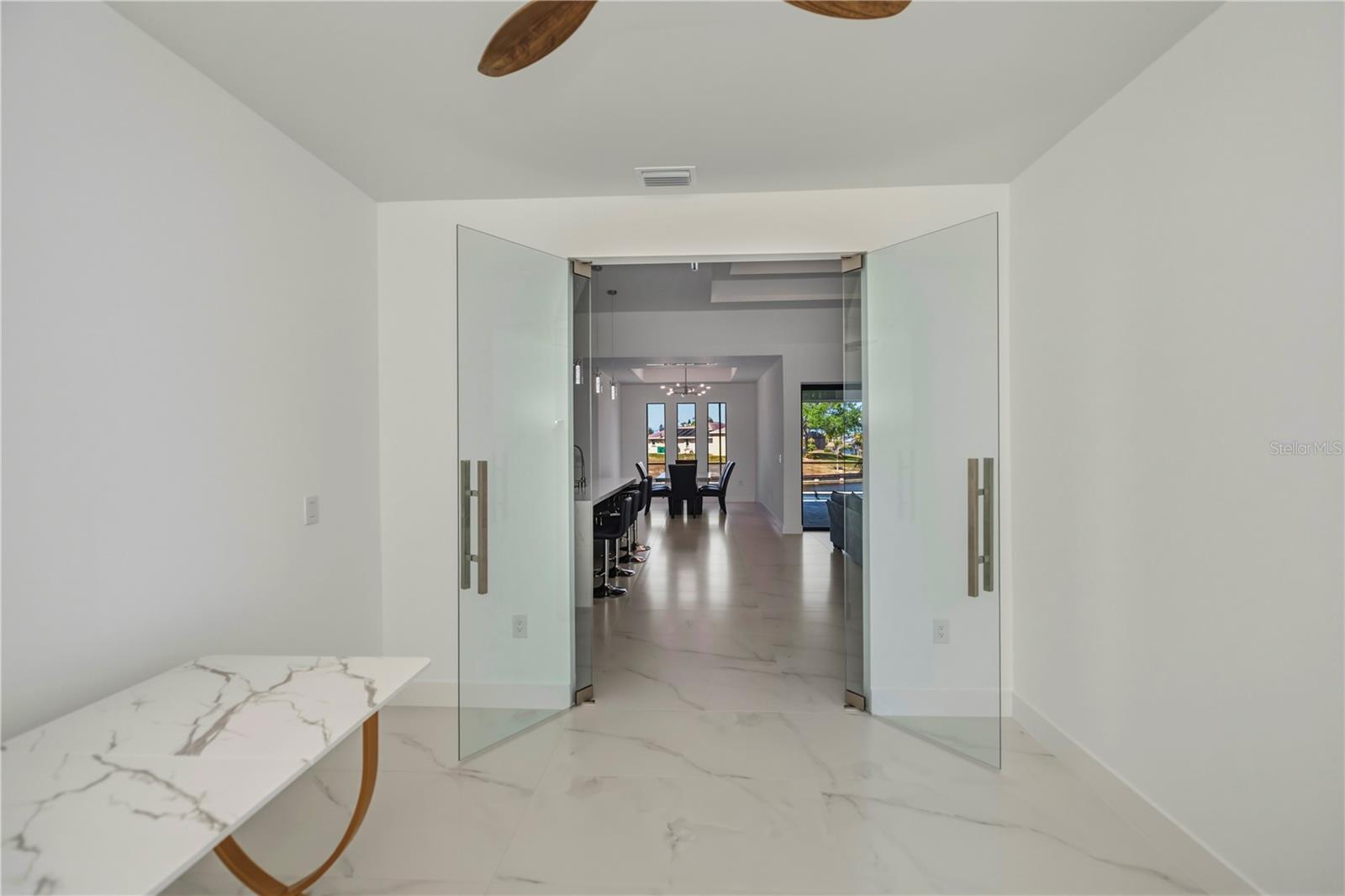 Office off living room with executive suite doors