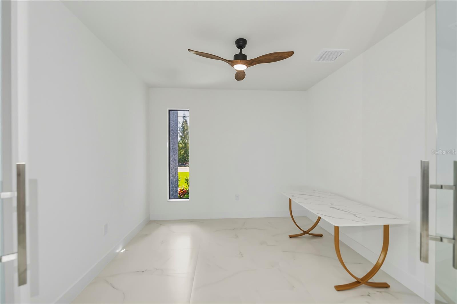 Office off living room with executive suite doors