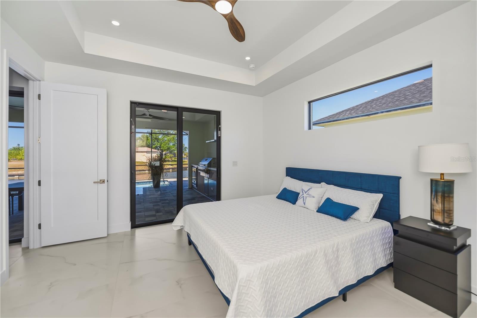 Primary Bedroom with Tray Ceiling and Water Views.