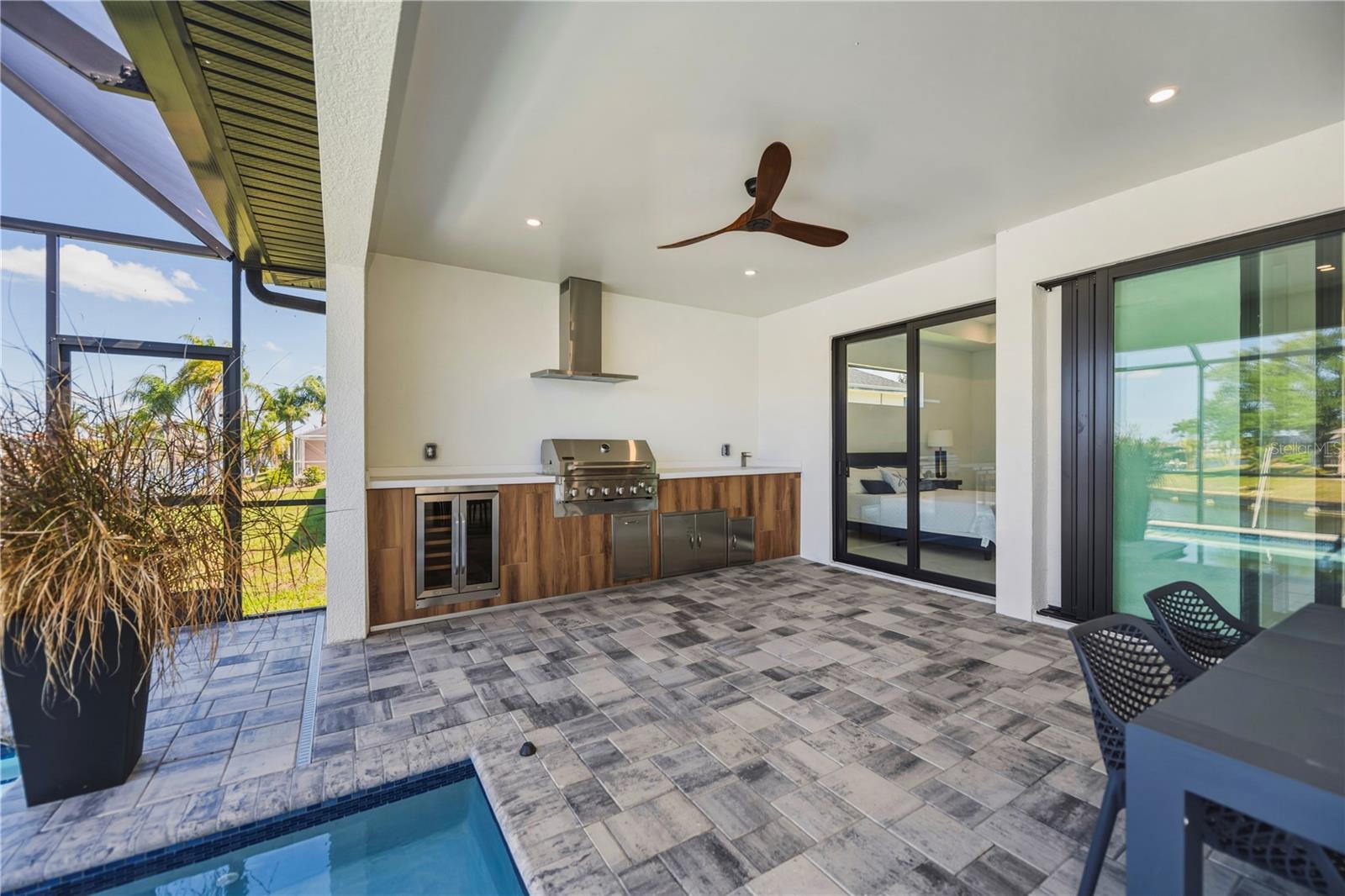 Professional Outdoor Kitchen with Poolside Dining.
