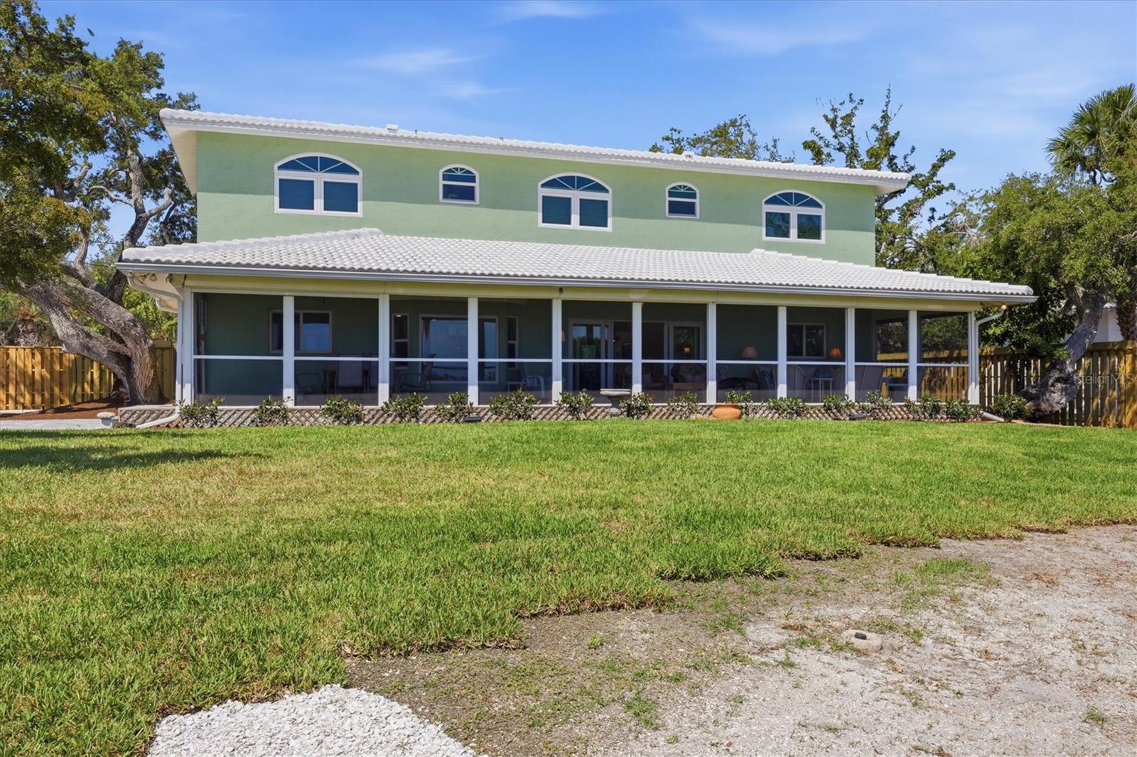 Back View of Home With Large Screened Lanai