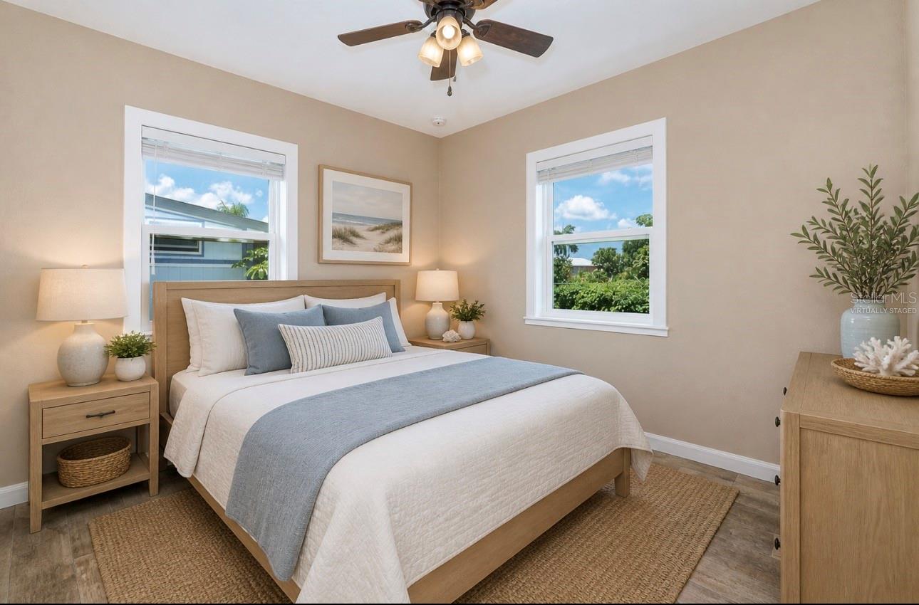 Virtually staged bedroom 1 with canal view