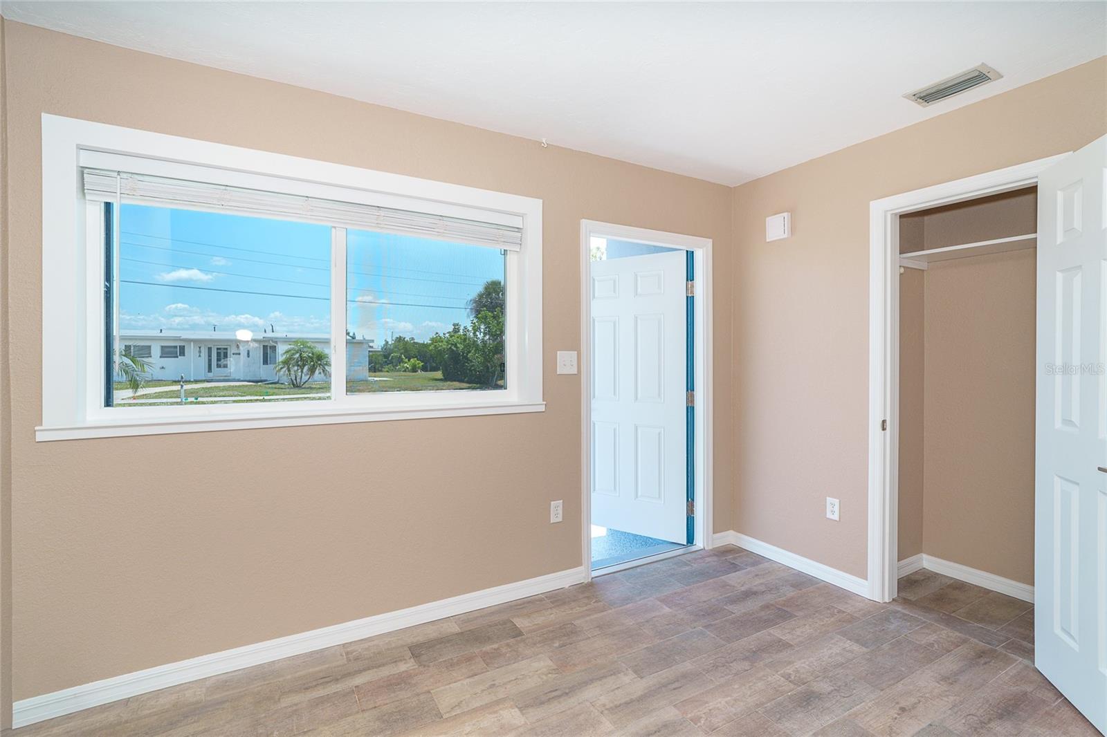 Living room with large entry closet