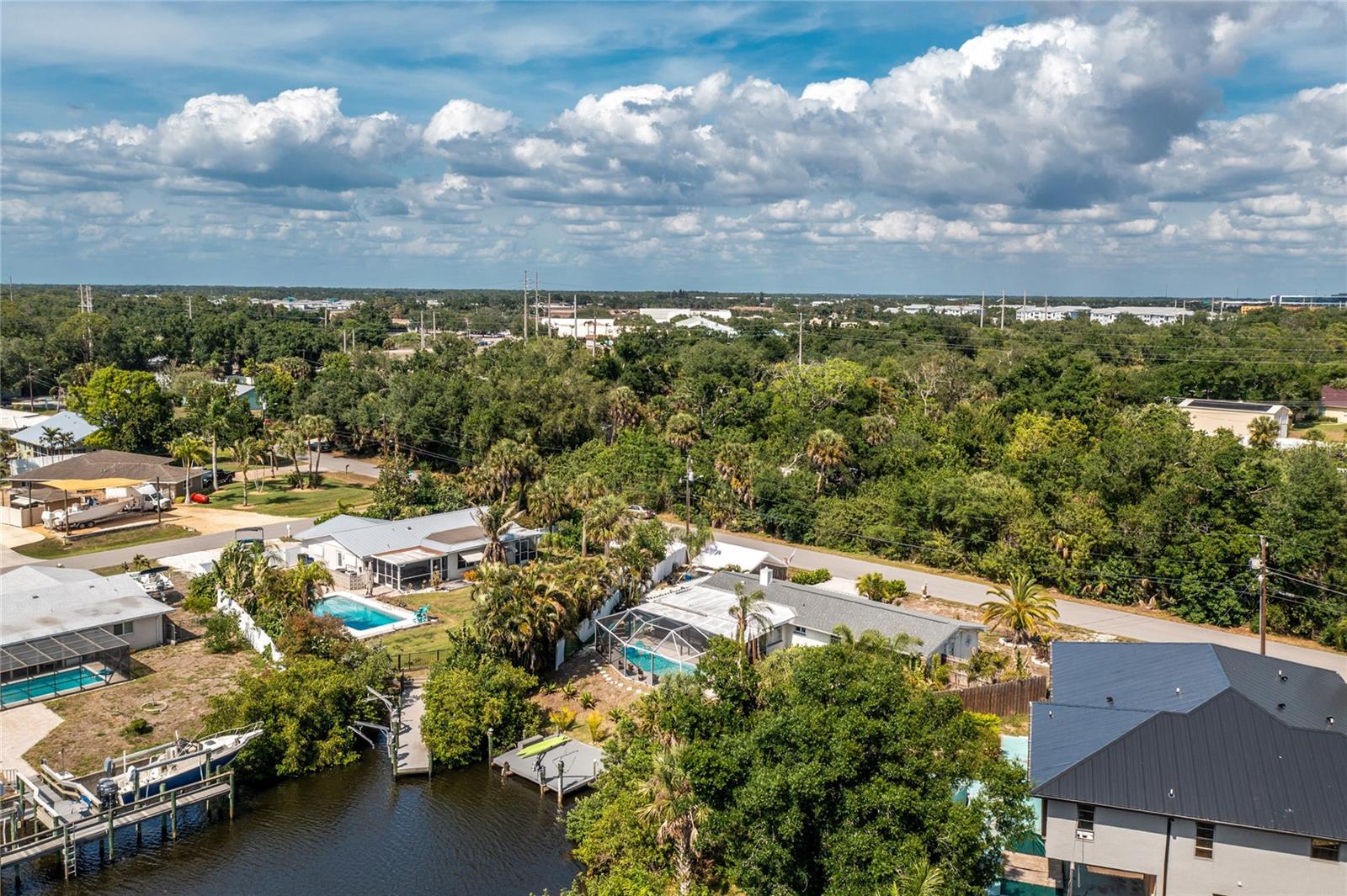 Aerial view of canal and house.
