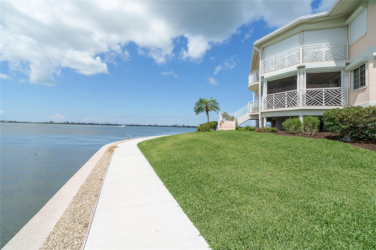 Unit 101 waterside lanai looking towards Little Gasparilla Island, and new walking path throughout the community.