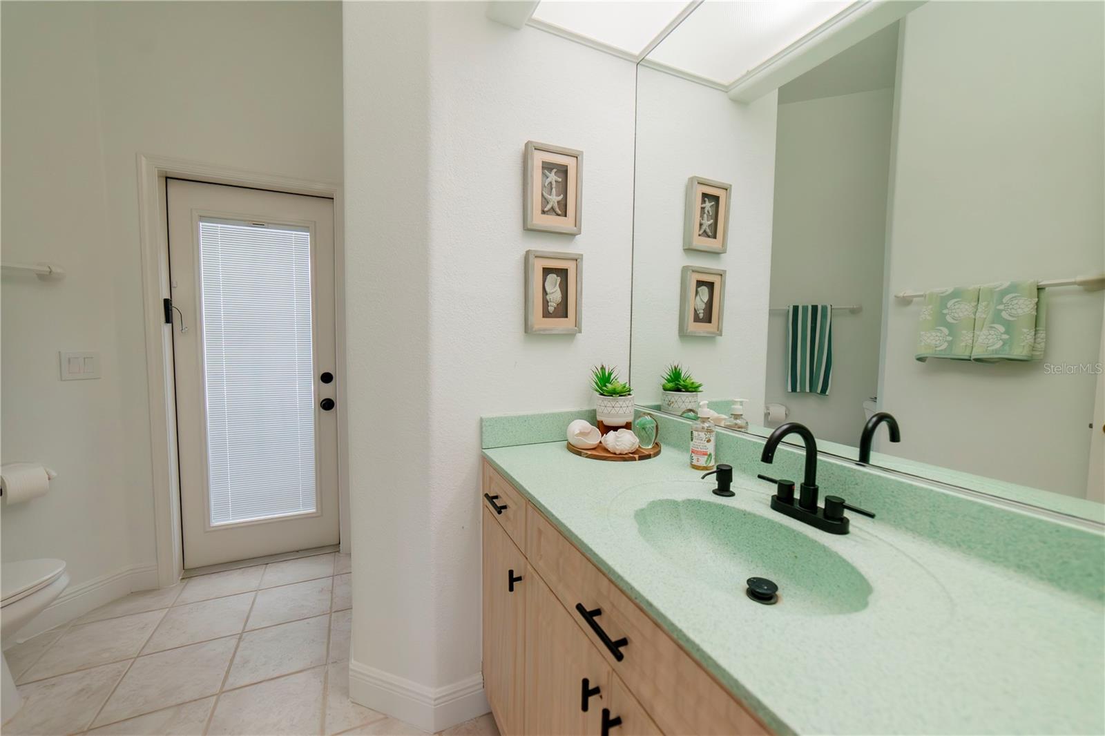 Guest Bath with shower and access to pool area