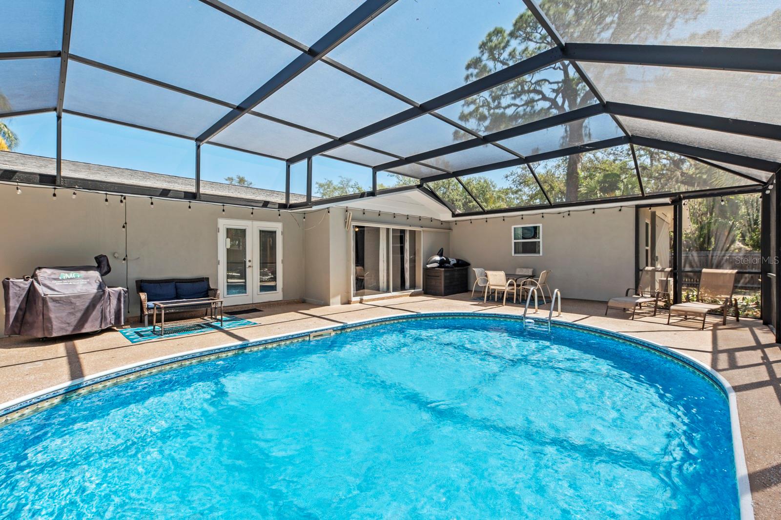 View of pool deck. Pool cage is now taken down.