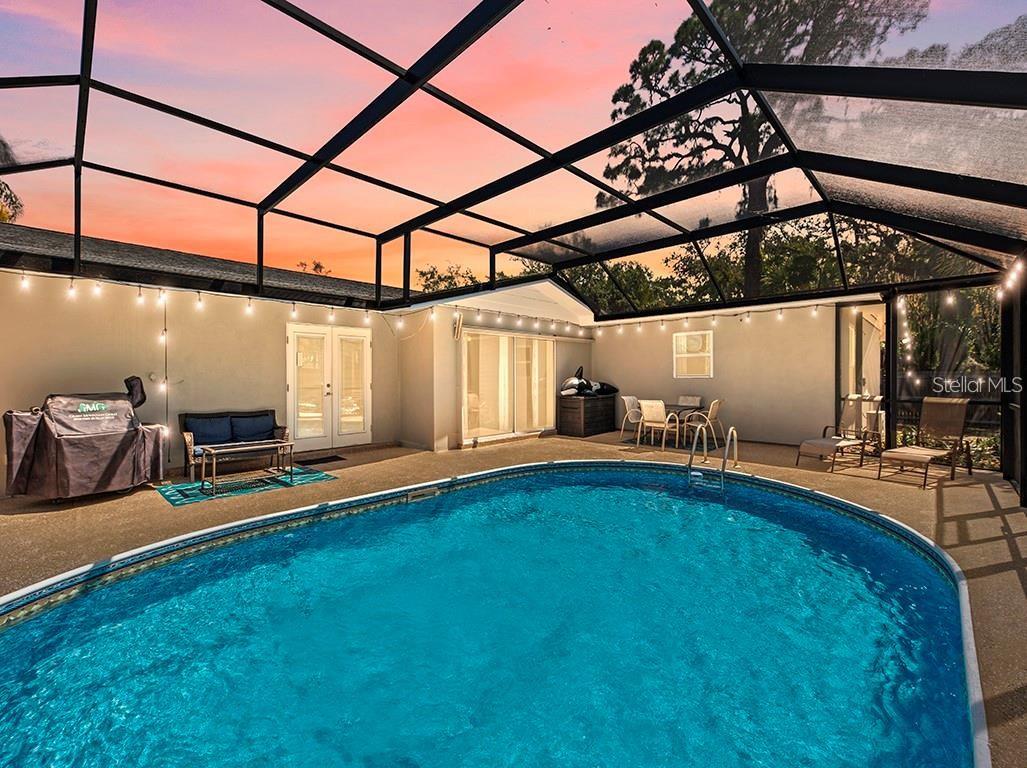 Pool deck lighting at night. Pool cage is now taken down.