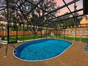 Backyard lighting at night. Pool cage is now taken down.