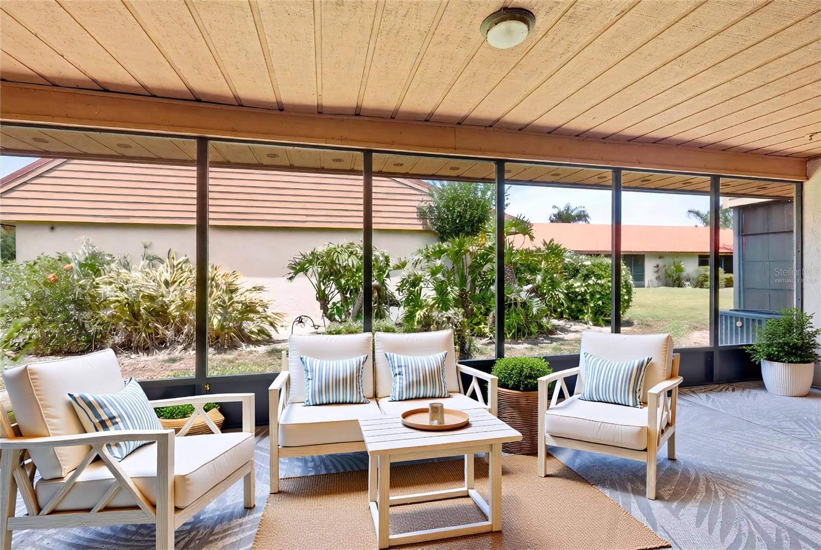 Virtually Staged- large back screened lanai