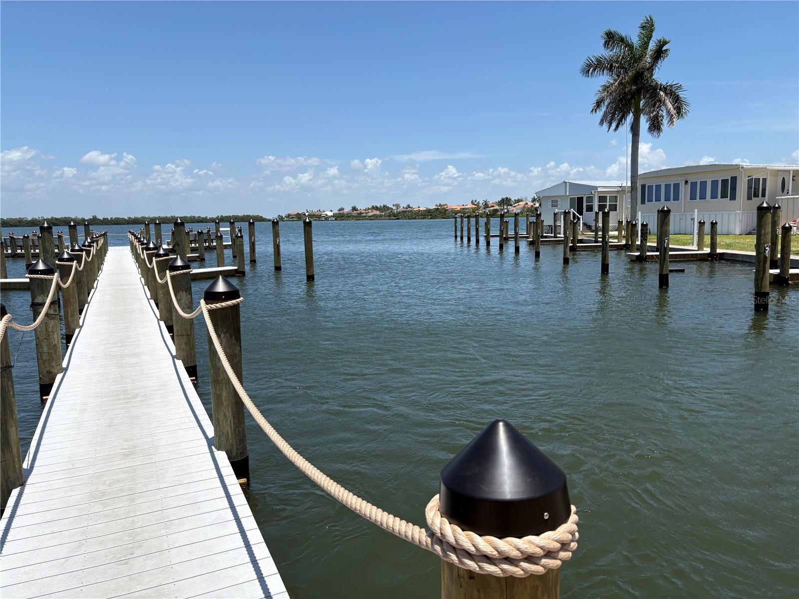 Dock down middle of marina, and showing partial right, facing east