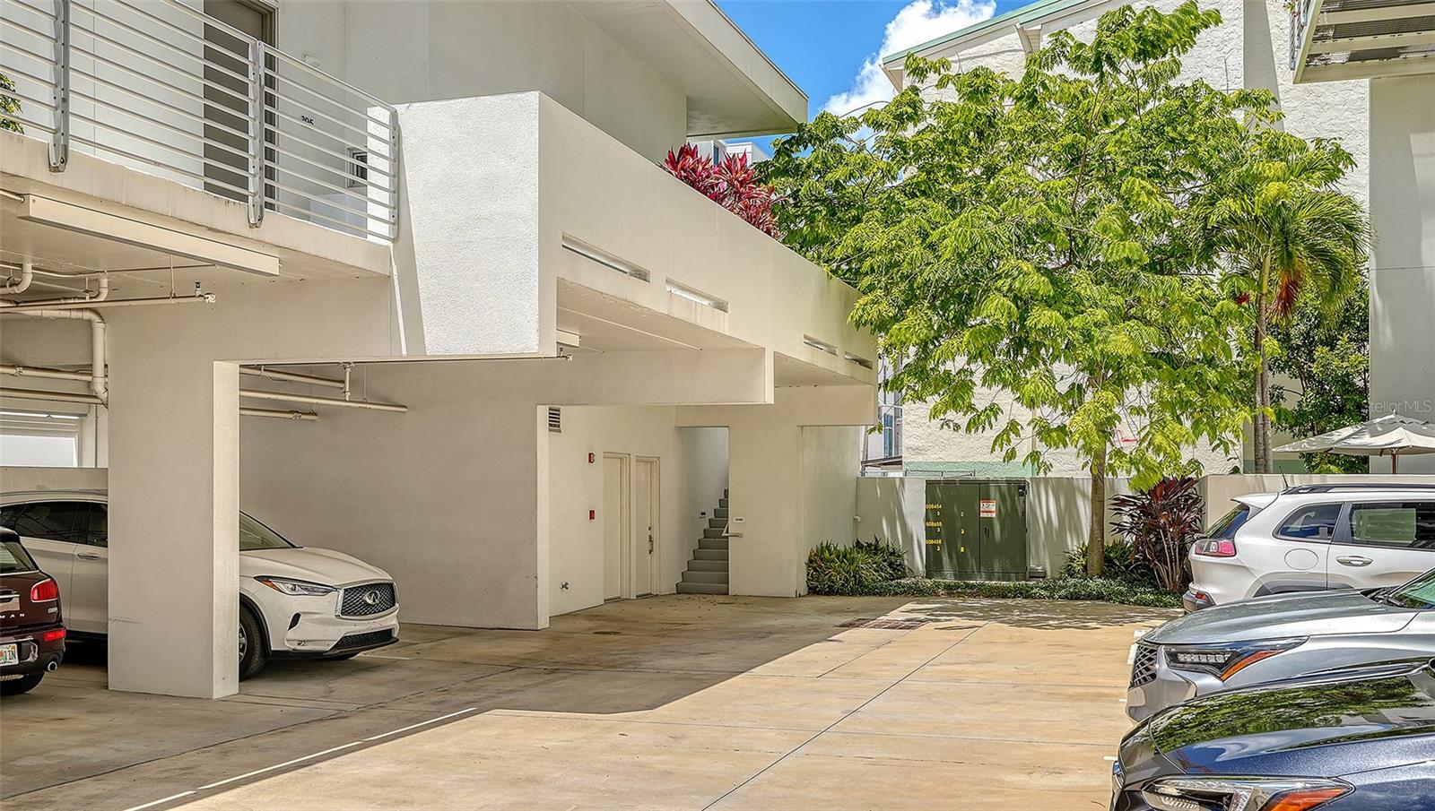 Spacious gated parking courtyard with secure entry off 4th Way.