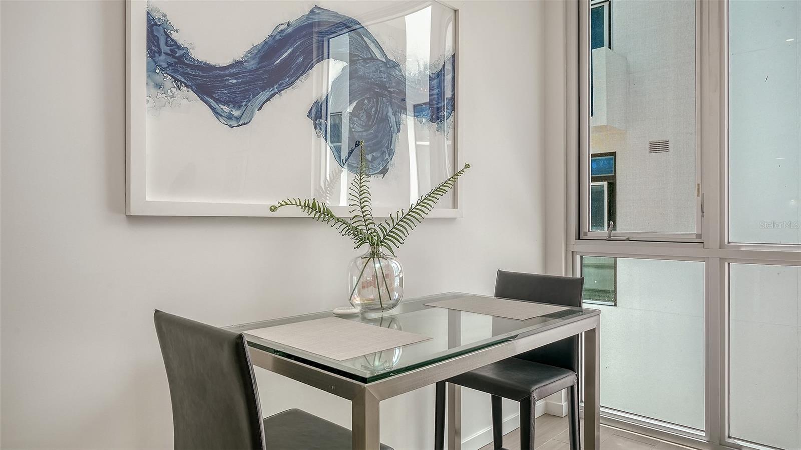 Energy-efficient impact glass walls maximize natural light and modern functionality.