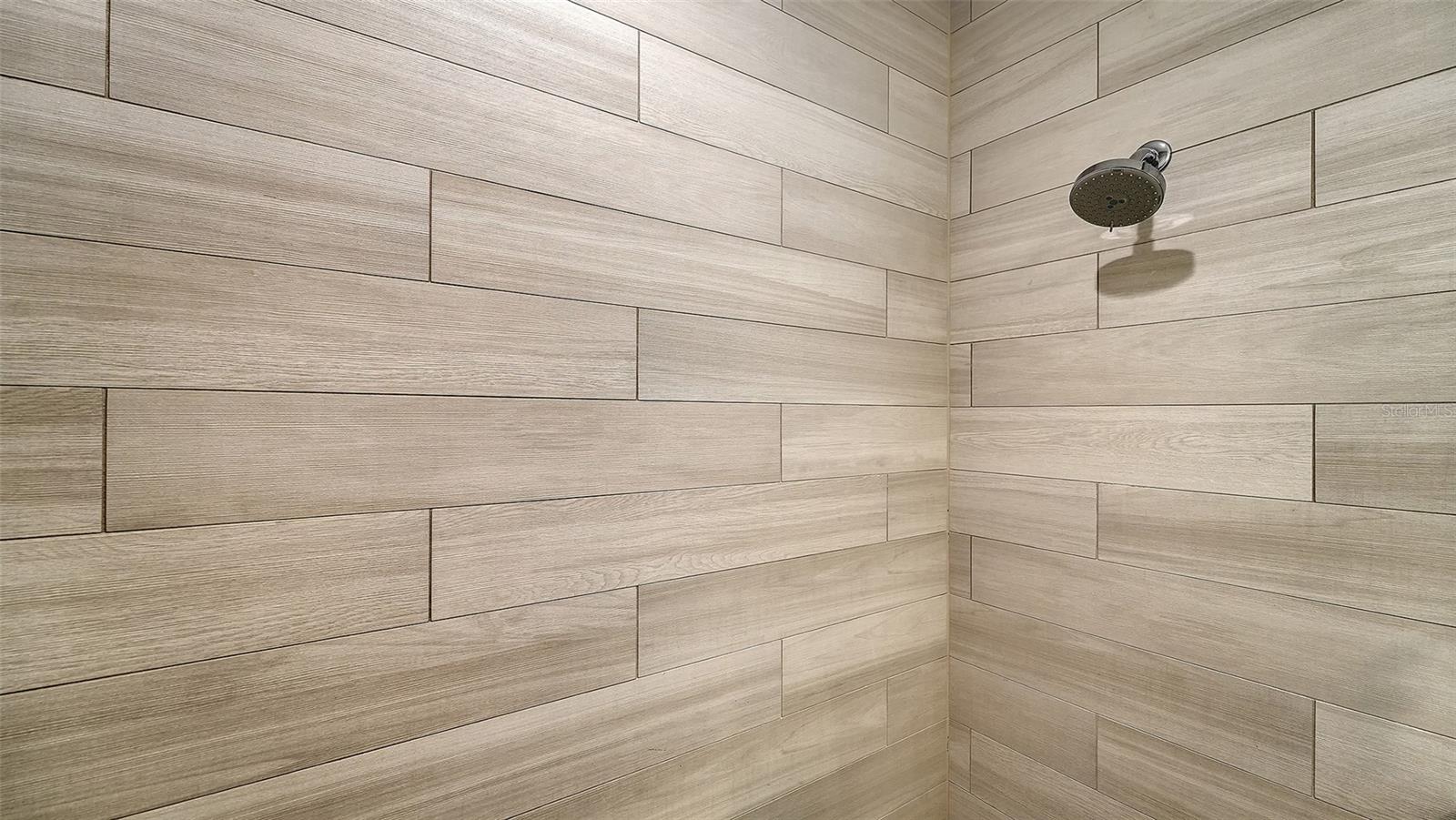 Large, spacious shower is ready for your usage.