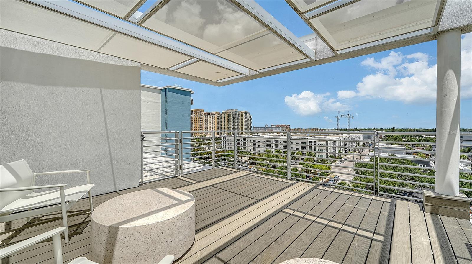Two shaded rooftop lounge areas for relaxation and social gatherings