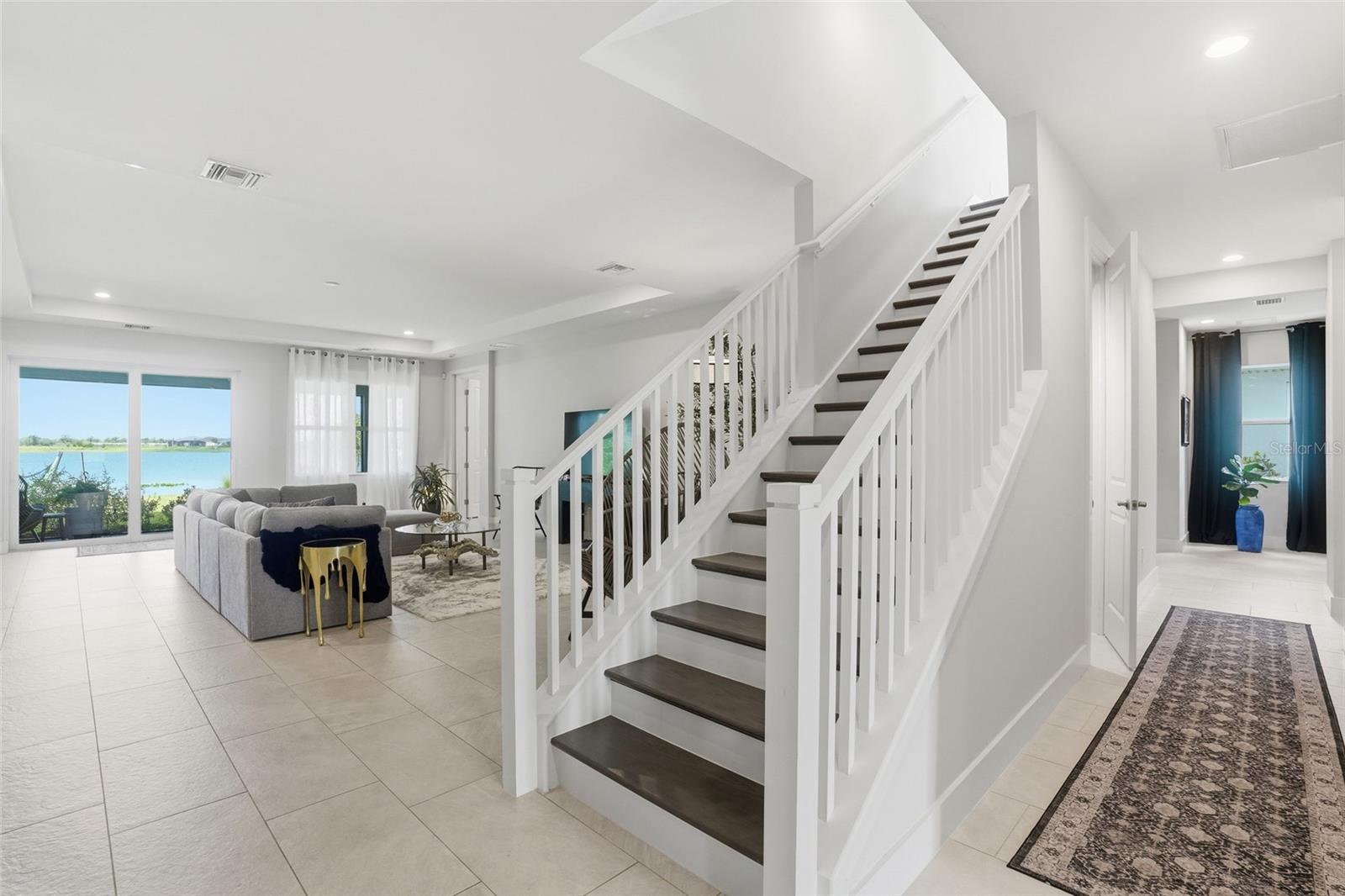 stairway to bonus rec room 4th bedroom and full bath great space for a nanny or extended family and or teenager