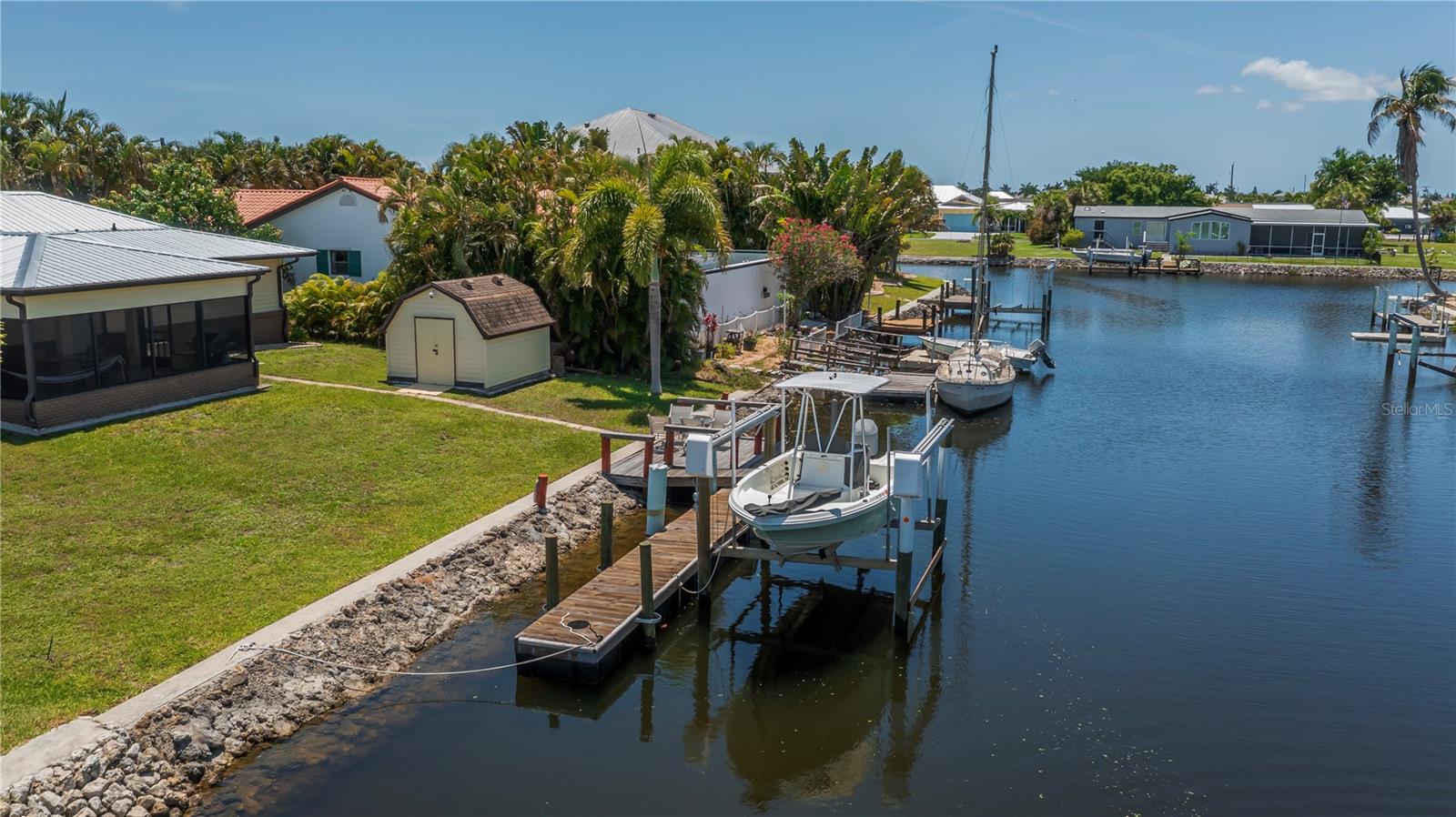 Private Dock and Boat Lift on Sailboat Access Canal.