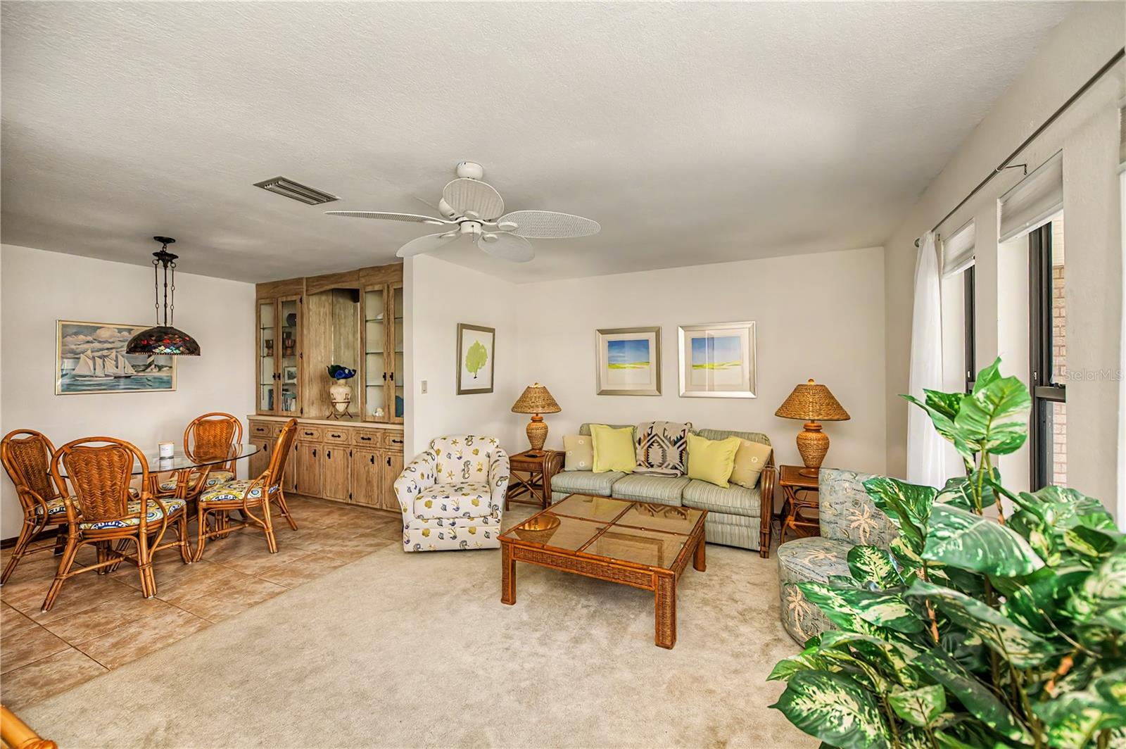 Living and Dining Area with Built In Cabinetry and Lots of Natural Light.