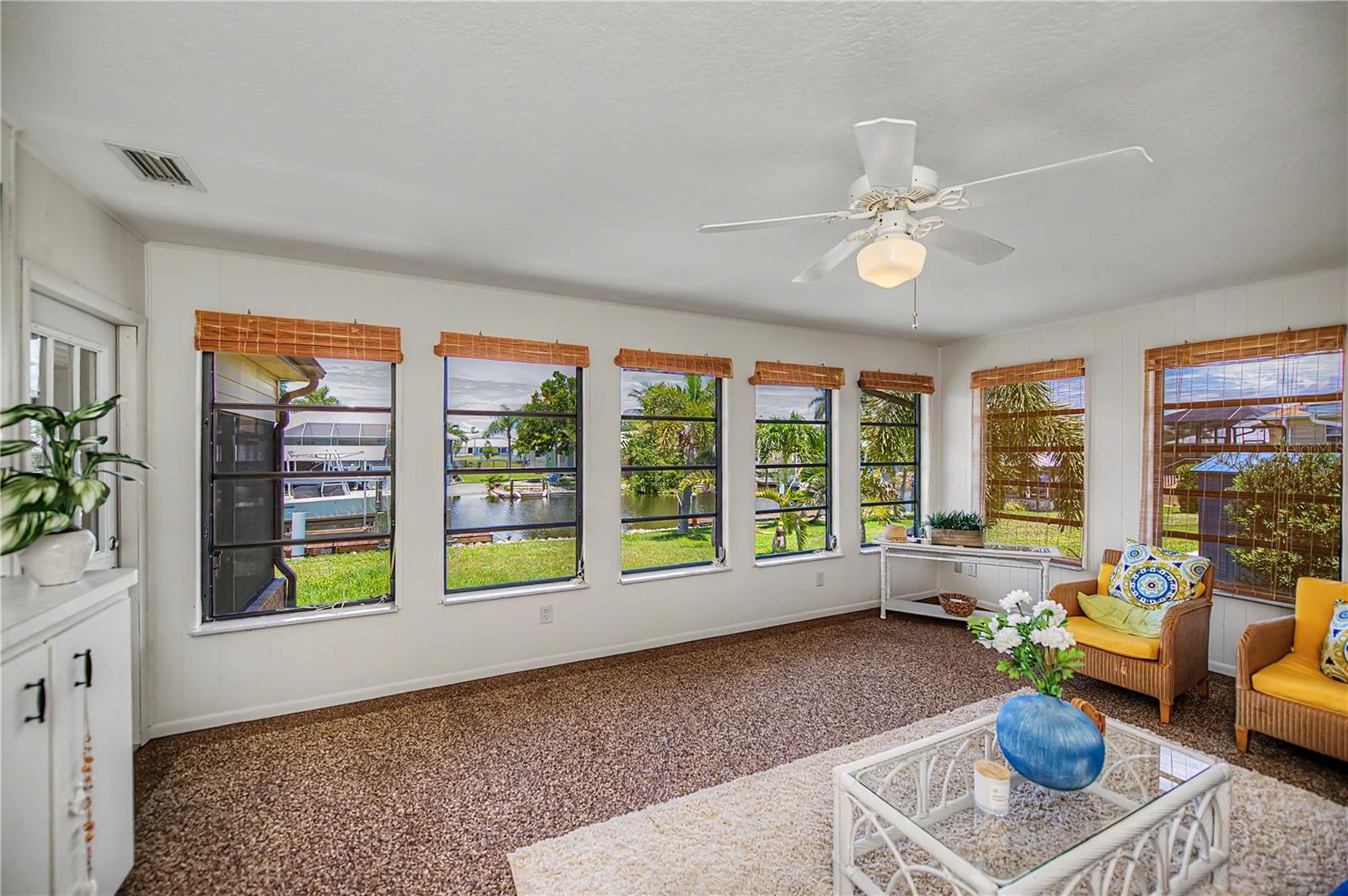 Florida Room, with Panoramic Water Views and an Abundance of Natural Light.