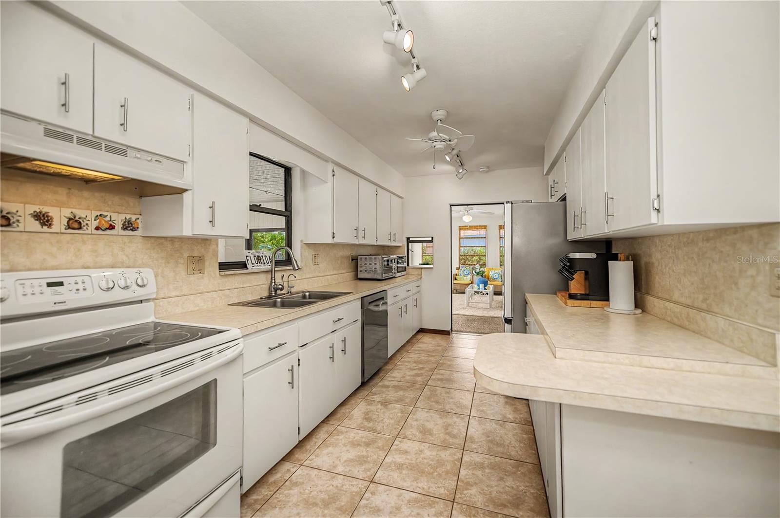 Galley Kitchen with Ample Cabinetry and Counter Space.