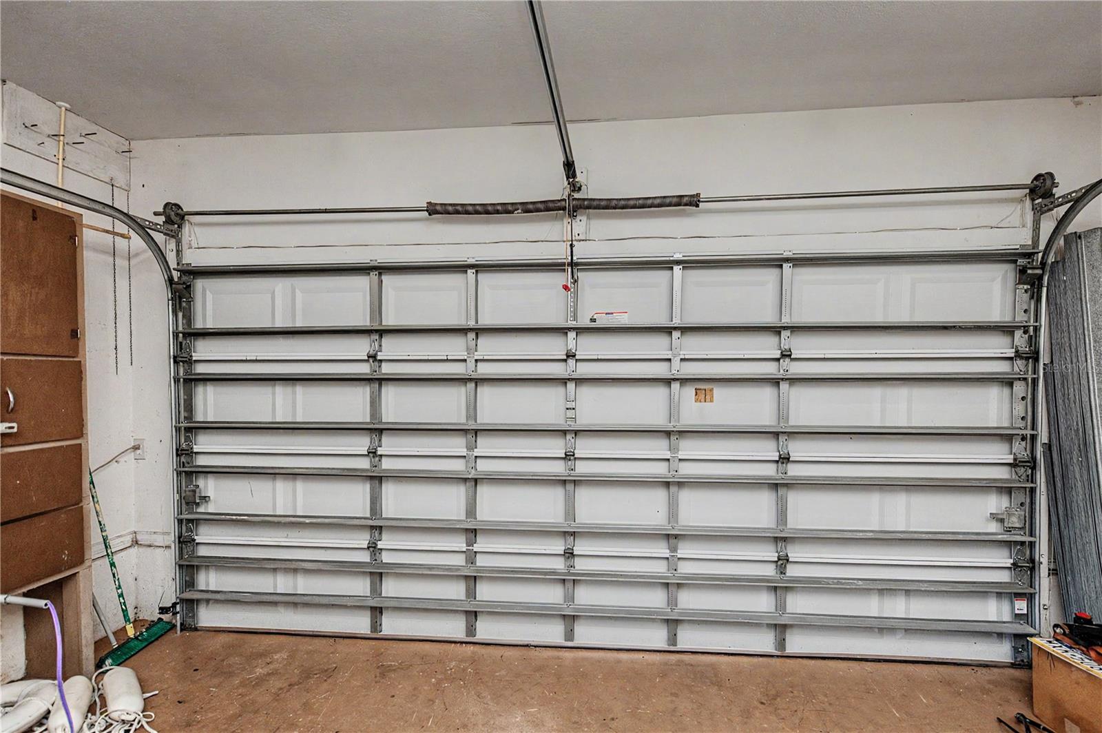 Attached Garage with Space for Parking, Storage and Workshop Needs.